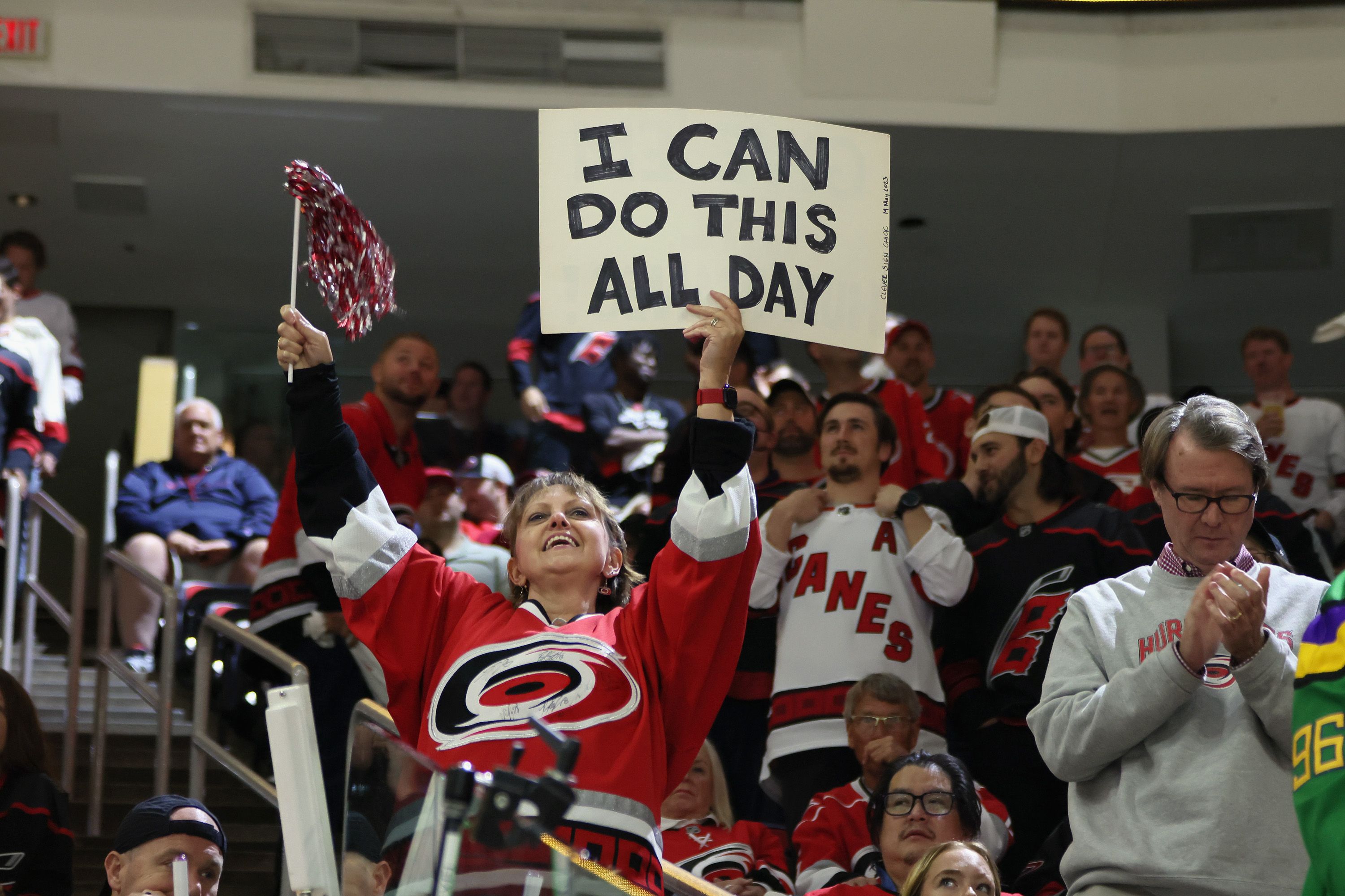 fan holds up sign reading i can do this all day