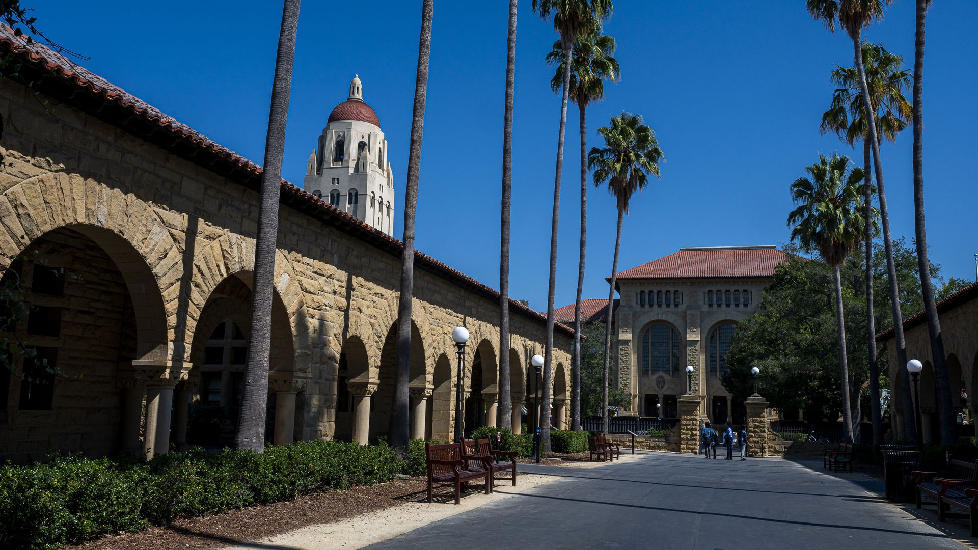 Photo of a walkway on the Stanford campus next to the Hoover Clock Tower 