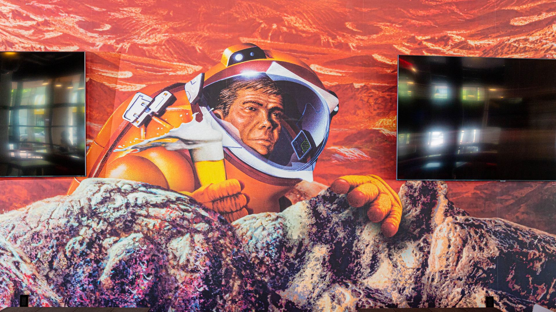 A mural of an astronaut holding a beer at the new Astro Beer Hall 