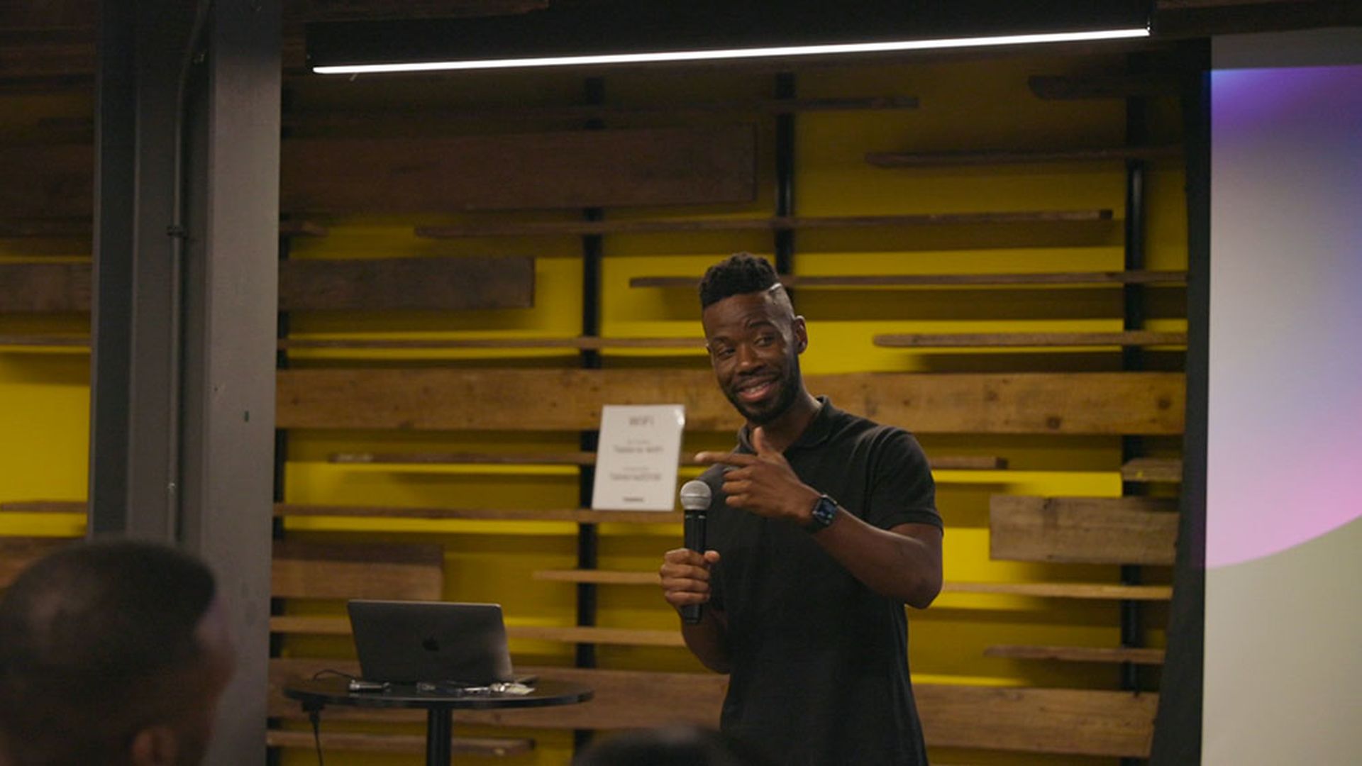 Dark Mode founder, Lou Kromah addresses the crowd at a Dark Mode networking night. Dark Mode's next networking night is Jan. 25. Photo: Courtesy of Dark Mode