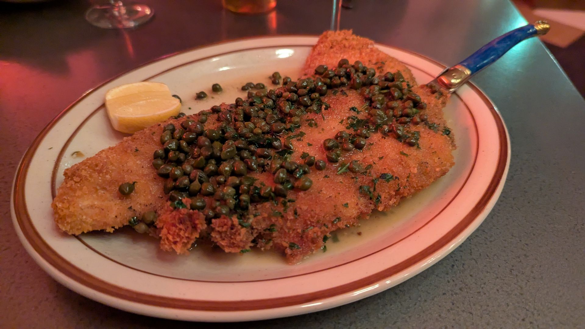 A plate with chilean sea bass on a table