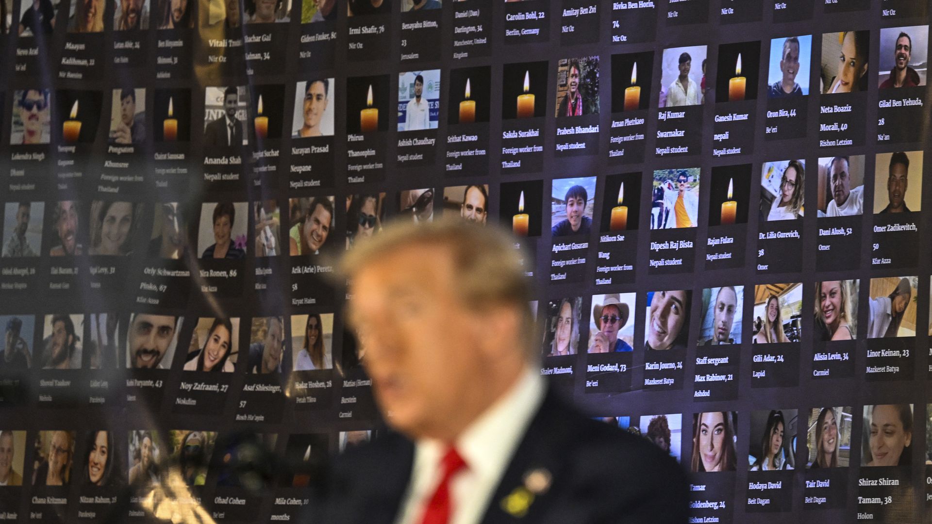 Pictures of hostages and victims are seen as former US President and Republican presidential candidate Donald Trump speaks during a remembrance event to mark the first anniversary of the Hamas attack on Israel at Trump National Doral golf club in Miami, Florida, on October 7, 2024.