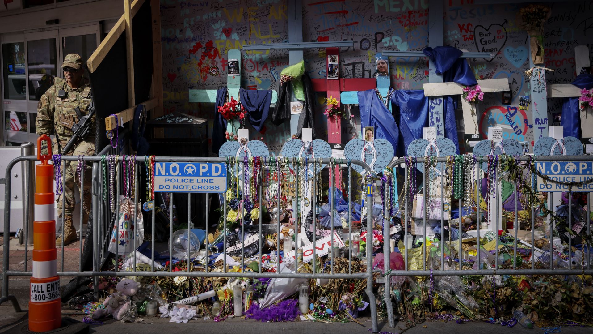 A barricade blocks off a makeshift memorial.