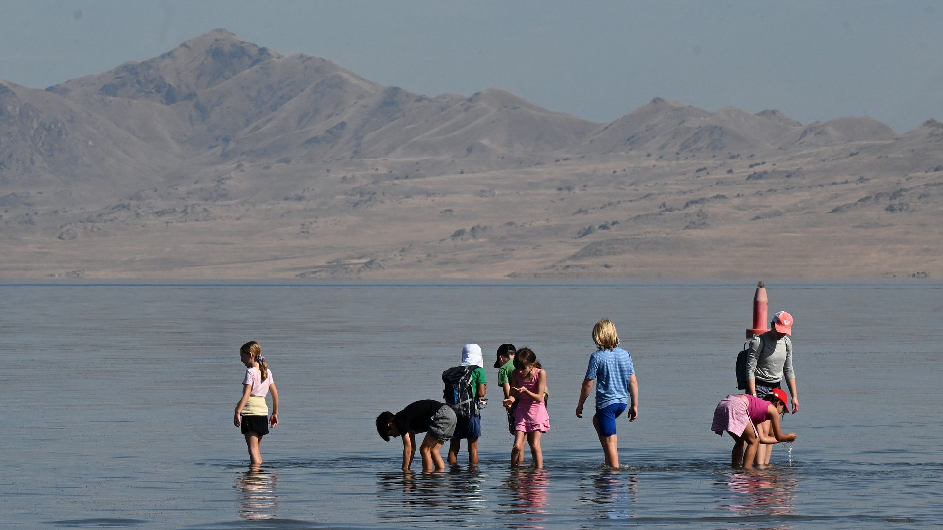 People wade in the Great Salt Lake