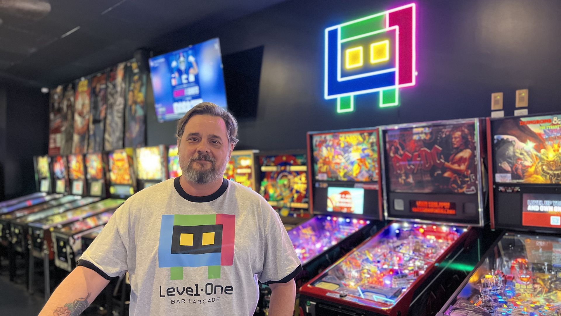 Level One owner John Reemtsen stands in front of the bar's pinball machines