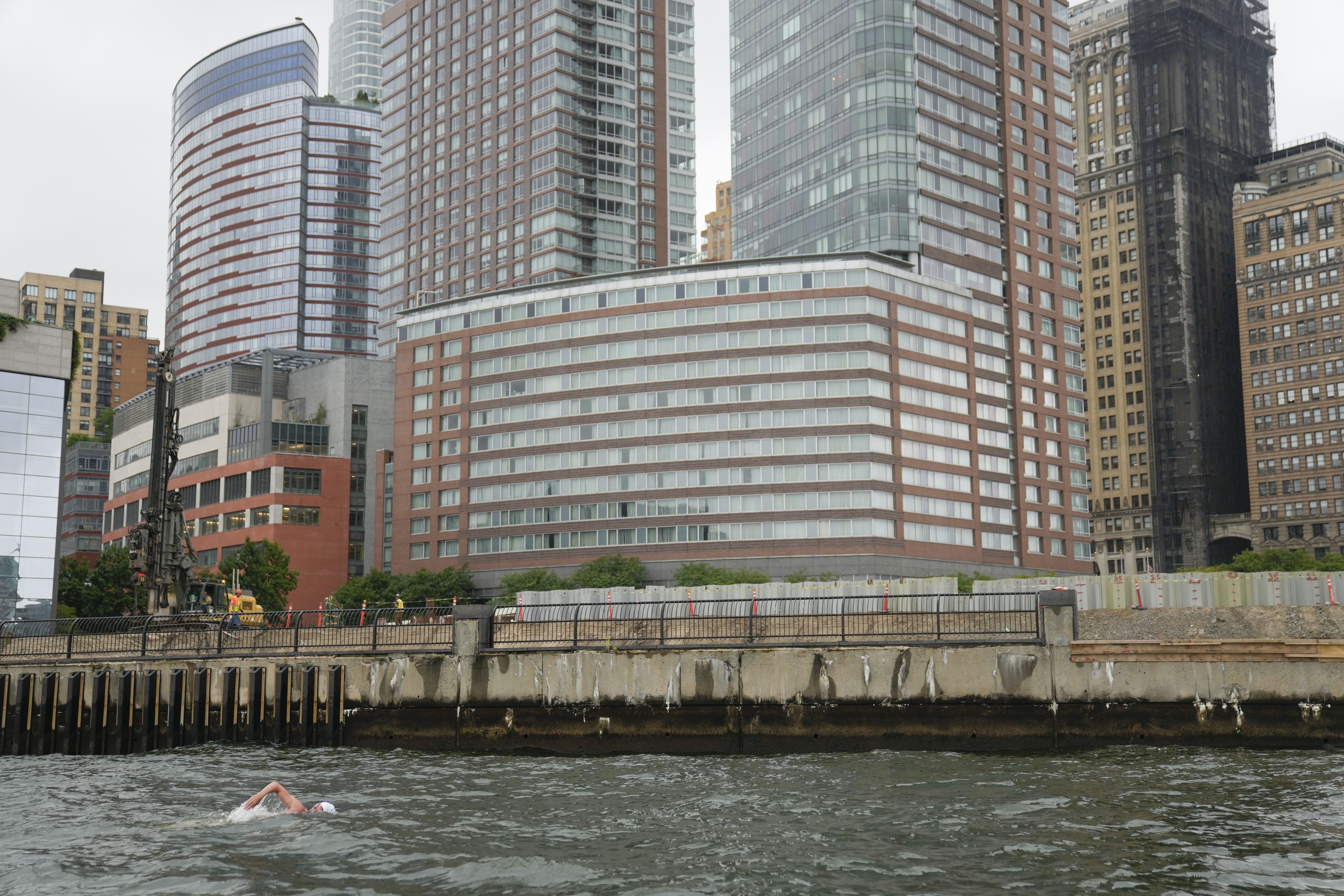 Lewis Pugh swims along the edge of lower Manhattan in New York, Wednesday, Sept. 13, 2023.