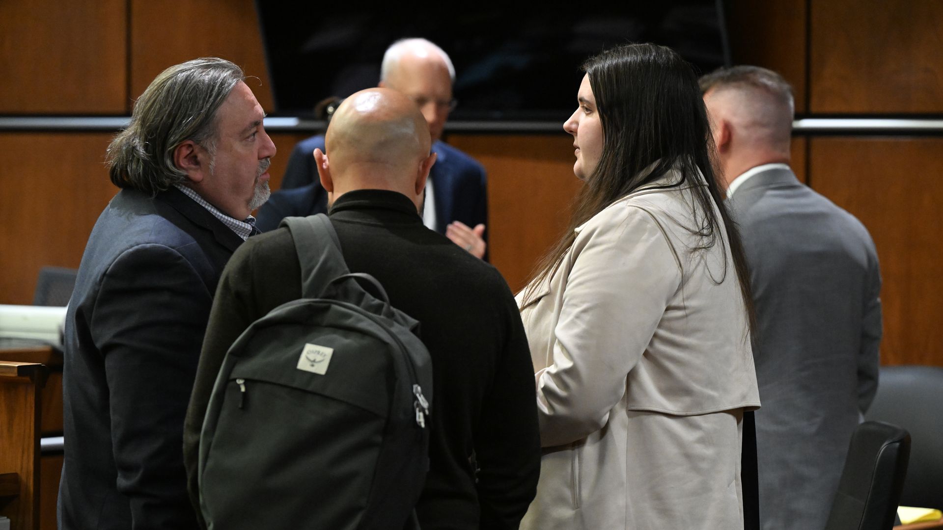 Yeva Smilianska, right, talks with her lawyer Timur Kishinevsky, left, at the Boulder County Courthouse.