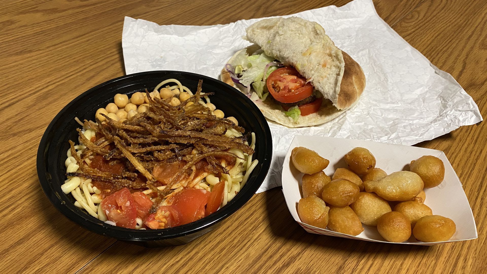 Meals served by the Koshary King food truck include a dish of koshary.