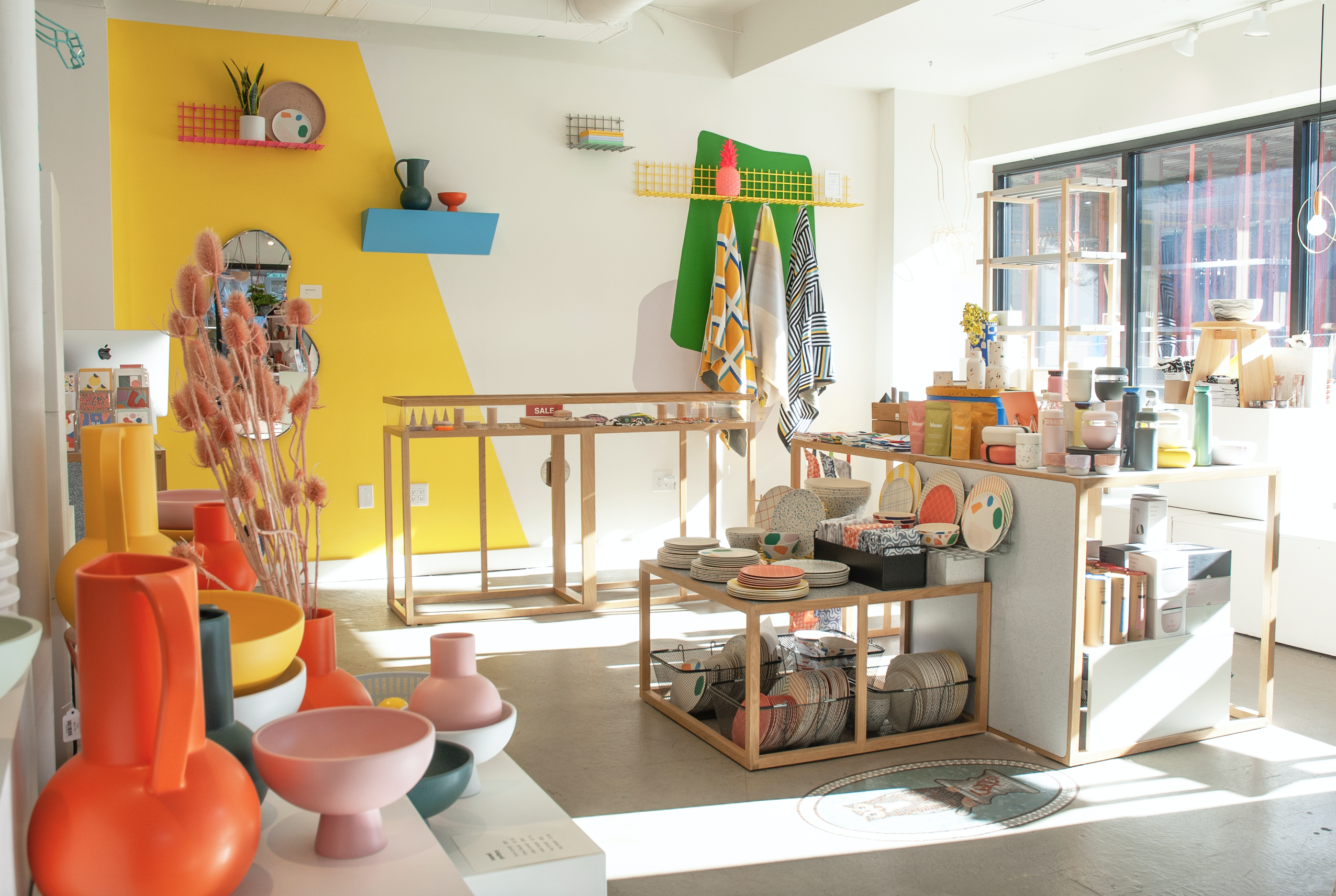 An interior photo of a gift shop with brightly colored walls.