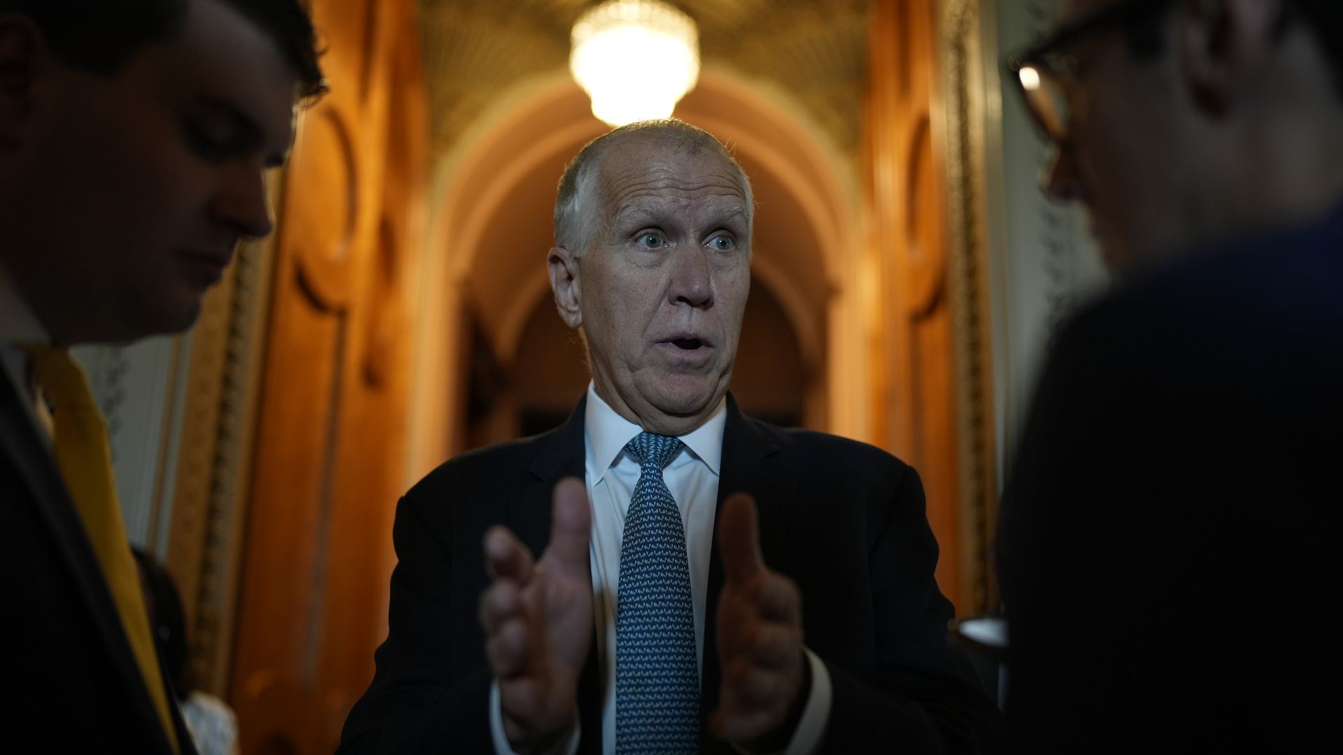 Sen. Thom TIllis (R-NC) speaks with reporters as he arrives for a vote at the U.S. Capitol 