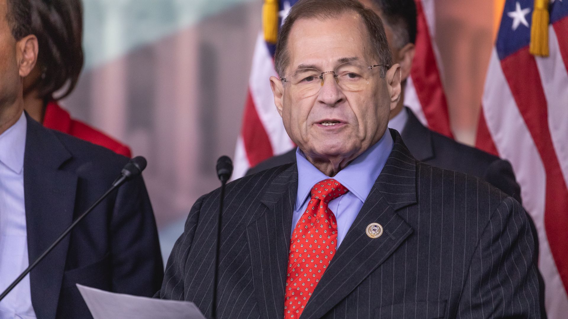 Rep. Jerry Nadler standing at a podium in the Capitol building wearing a red tie.