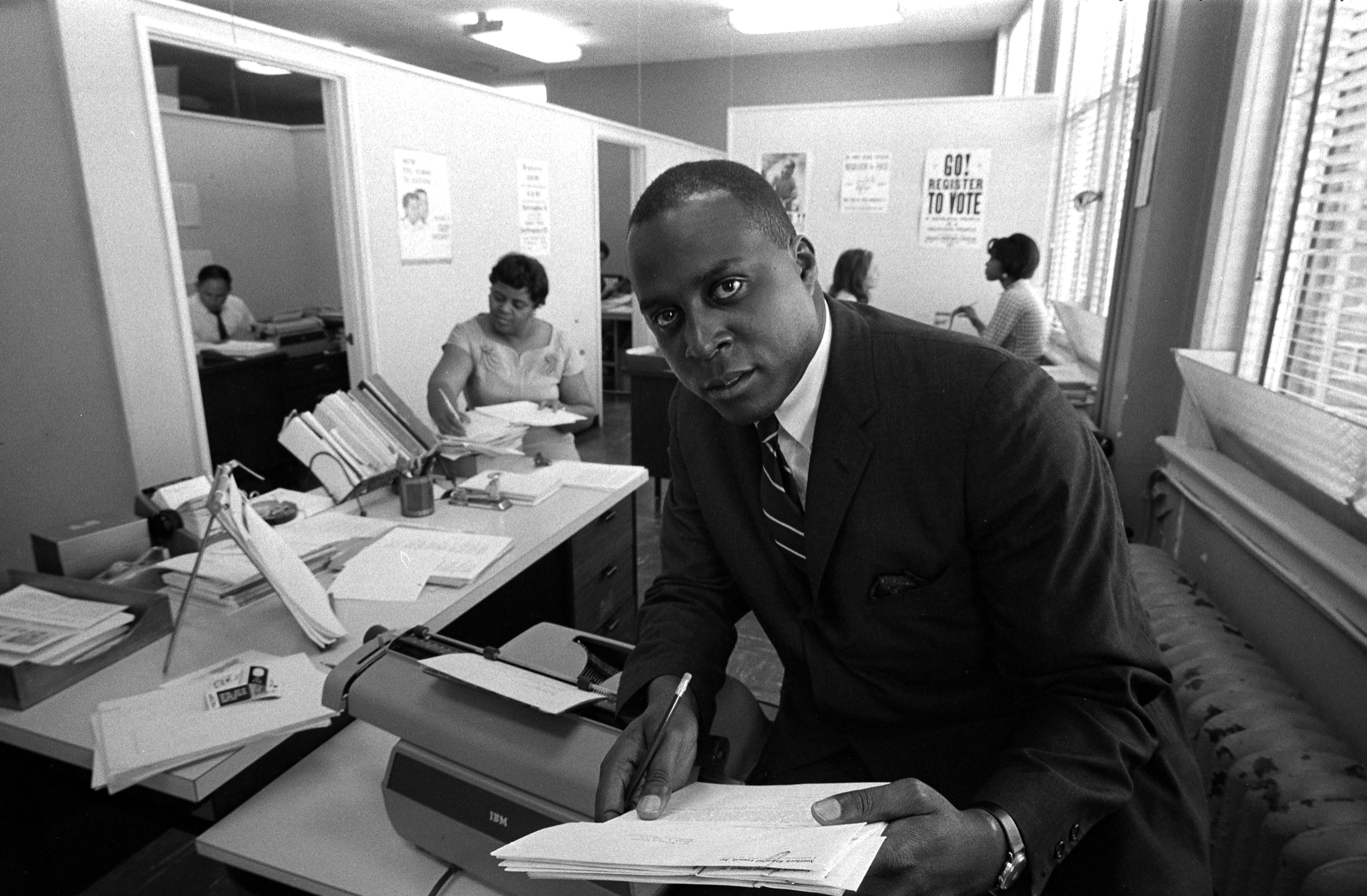 Portrait of African American lawyer (and later advisor to American President Bill Clinton) Vernon Jordan (1935 - 2021) as he sits on a desk while working on a voter education project at the Southern Regional Council in Atlanta, Georgia, June 15, 1967. (Photo by Leffler/Library of Congress/Interim Archives/Getty Images)