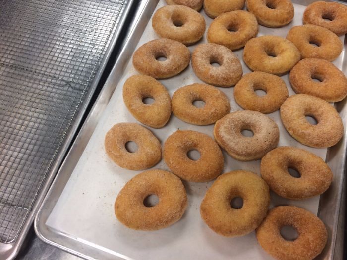 Cinnamon-sugar doughnuts hot out of the fryer