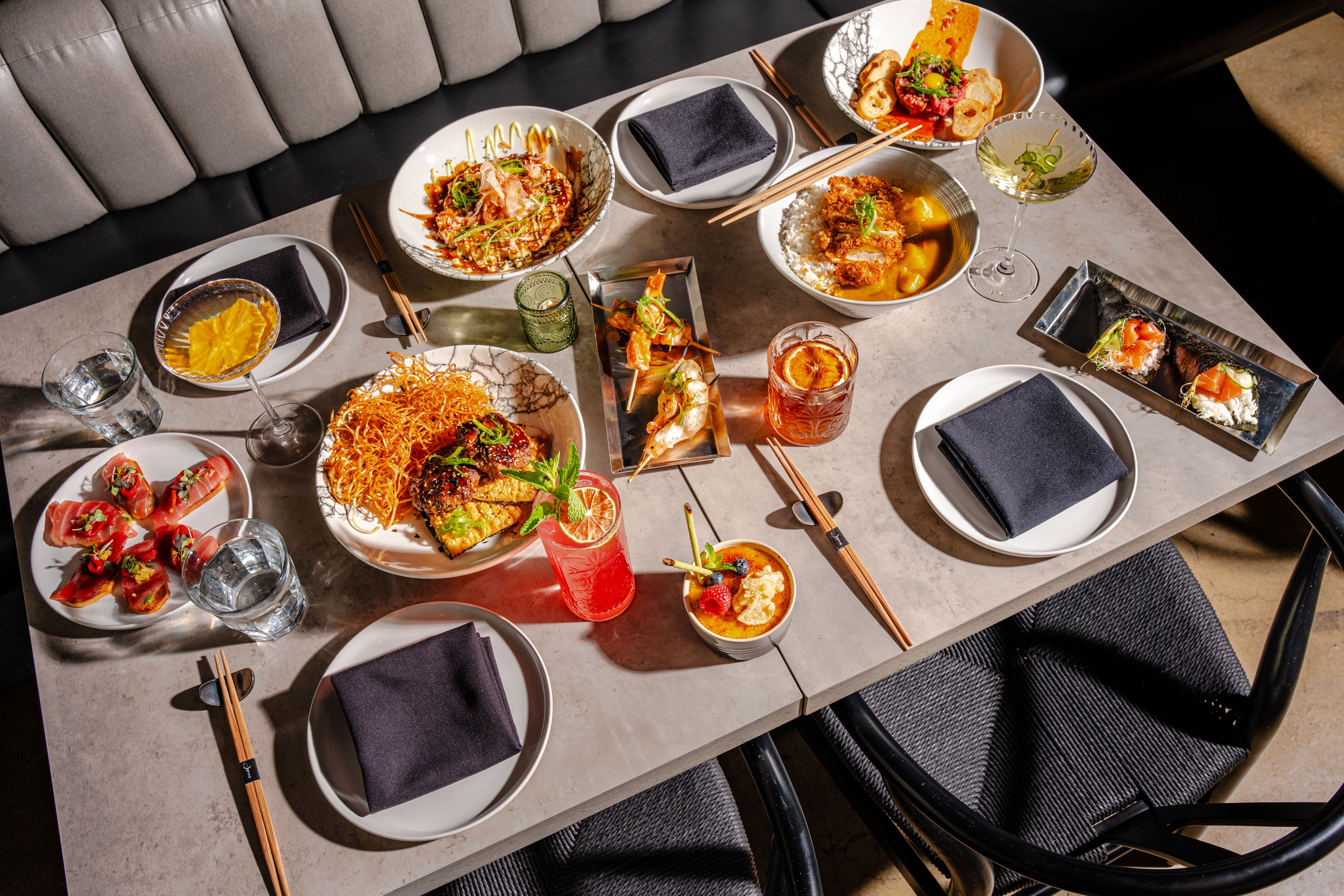 A table filled with different Japanese plates 