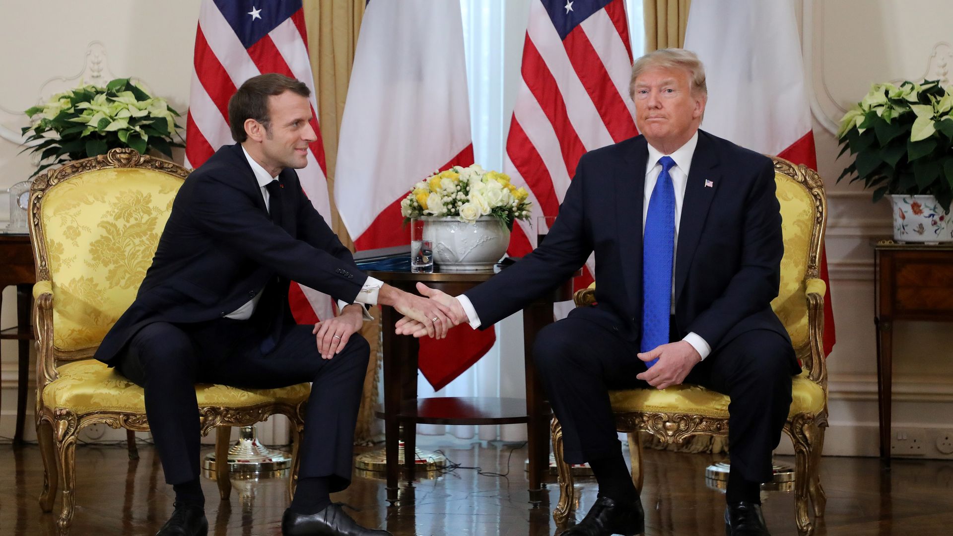 Trump and Macron shaking hands