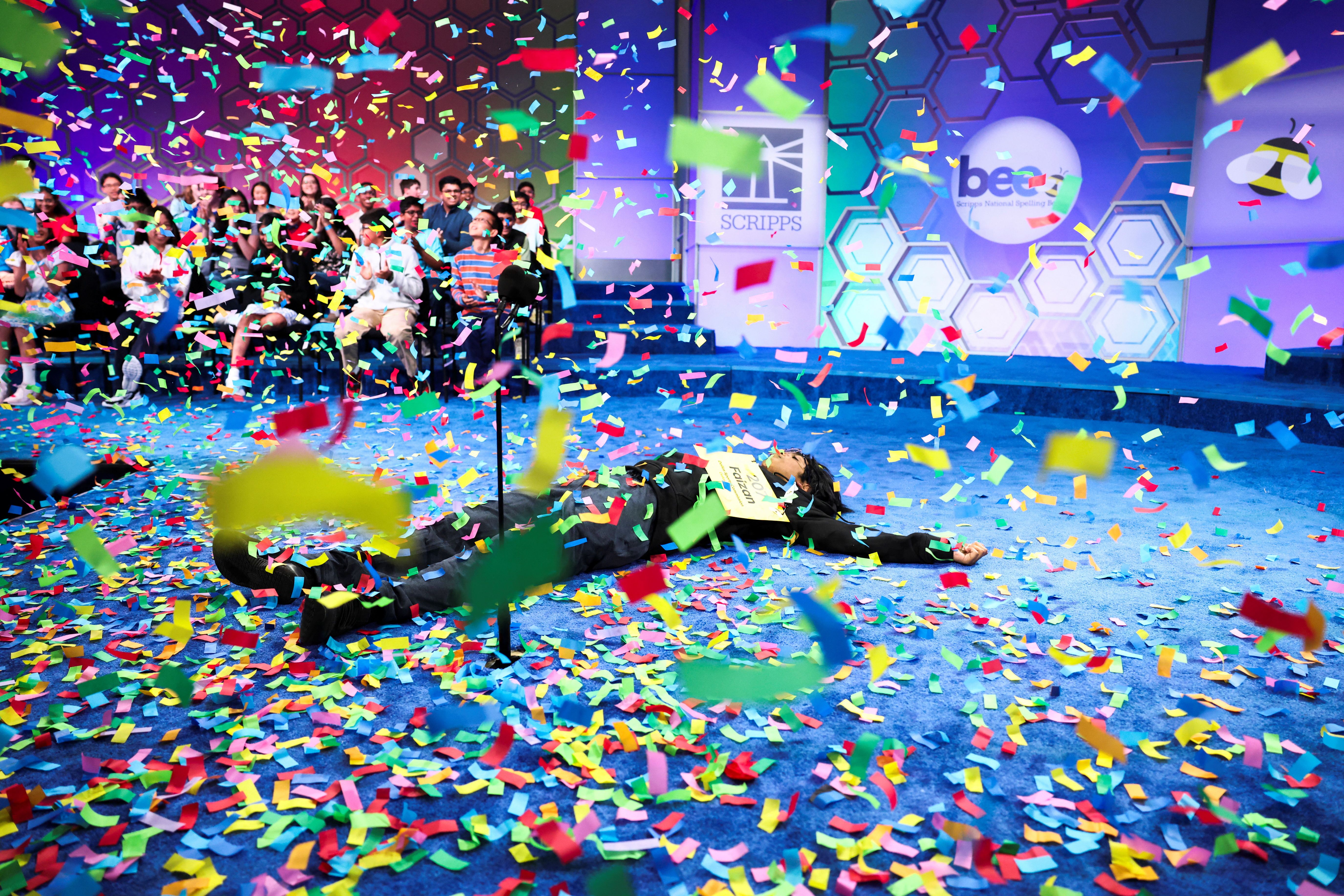 Faizan Zaki celebrates after winning the spelling bee last night.