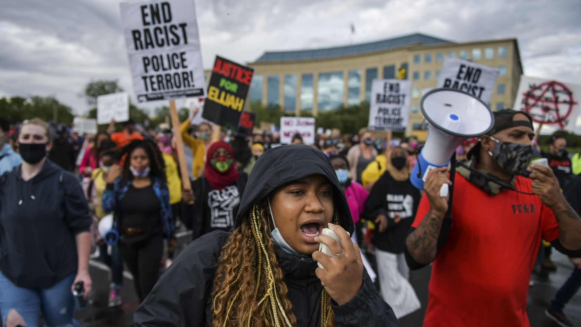 People marching in the street to protest the death of Elijah McClain on July 25, 2020 in Aurora, Colorado.
