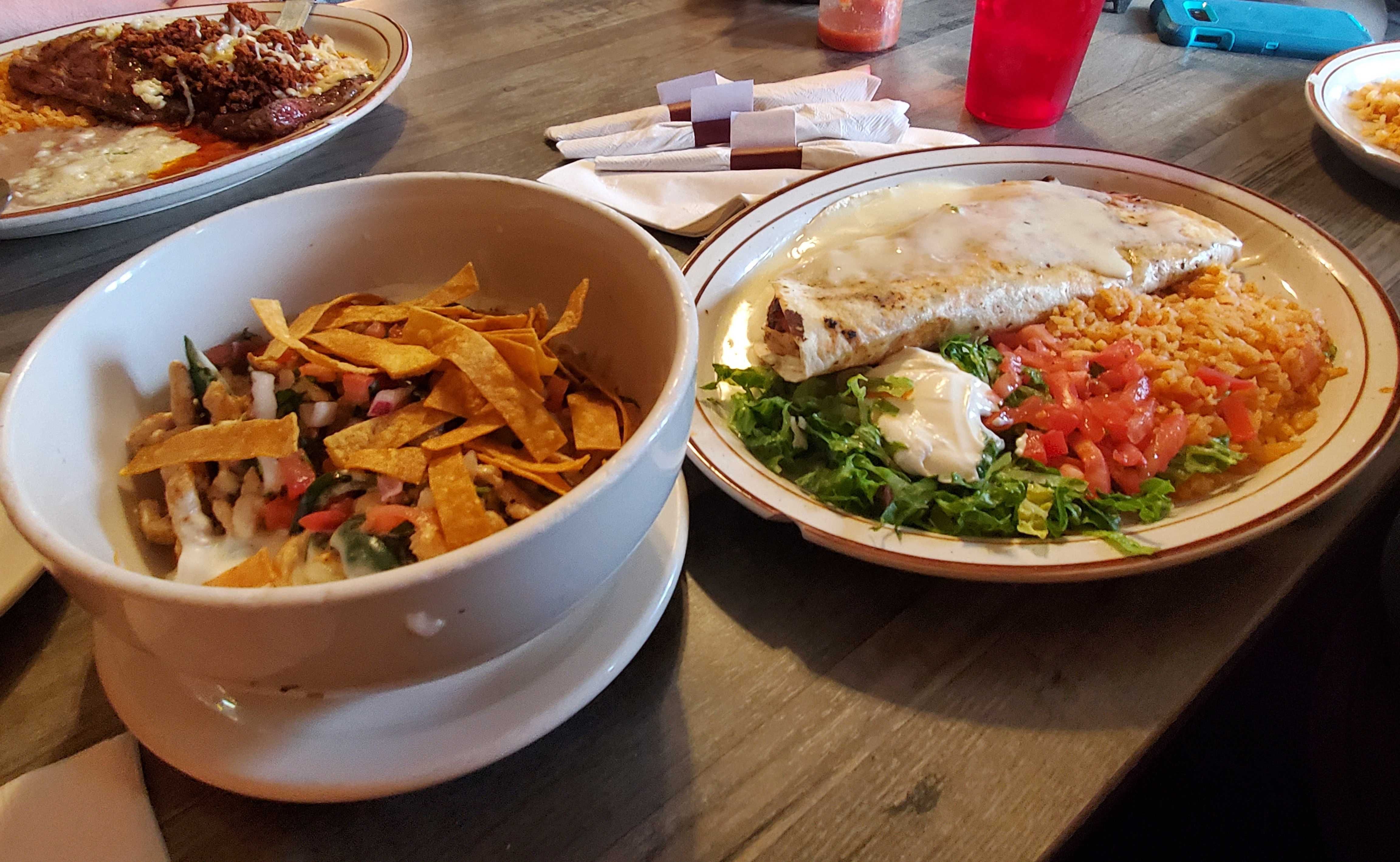 A collection of entrees from a Mexican restaurant. 