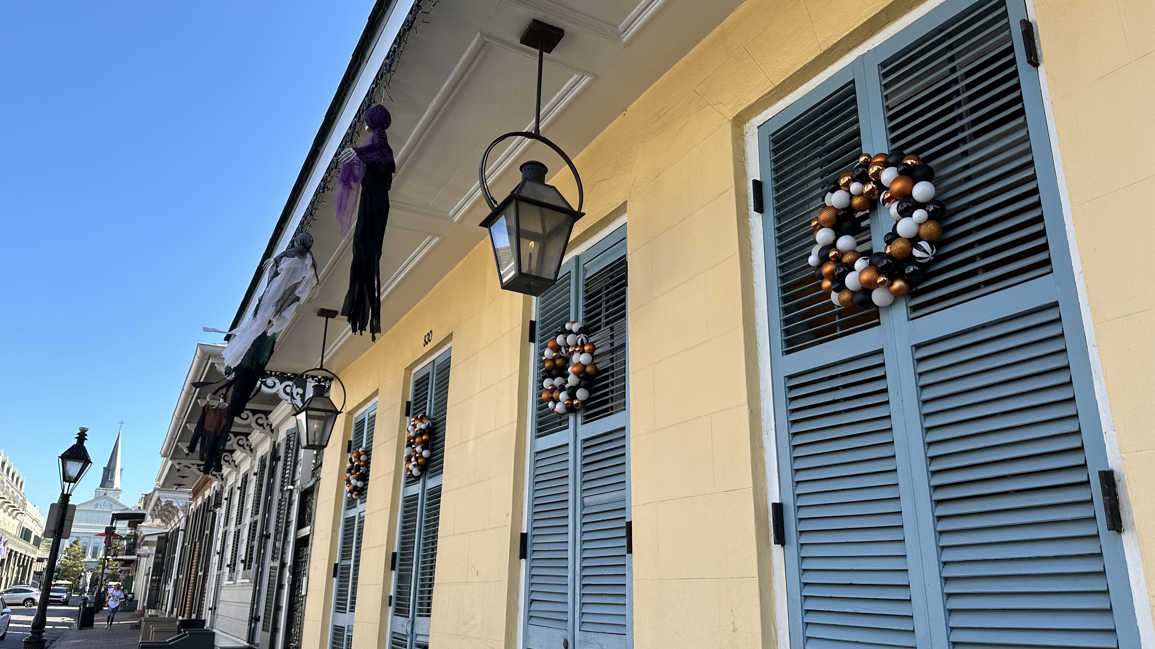 Image shows Halloween wreaths on a French Quarter home.