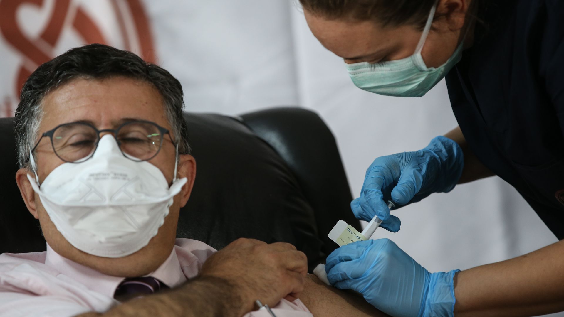 Picture of a trial volunteer getting the phase 3 vaccine developed by Pfizer.