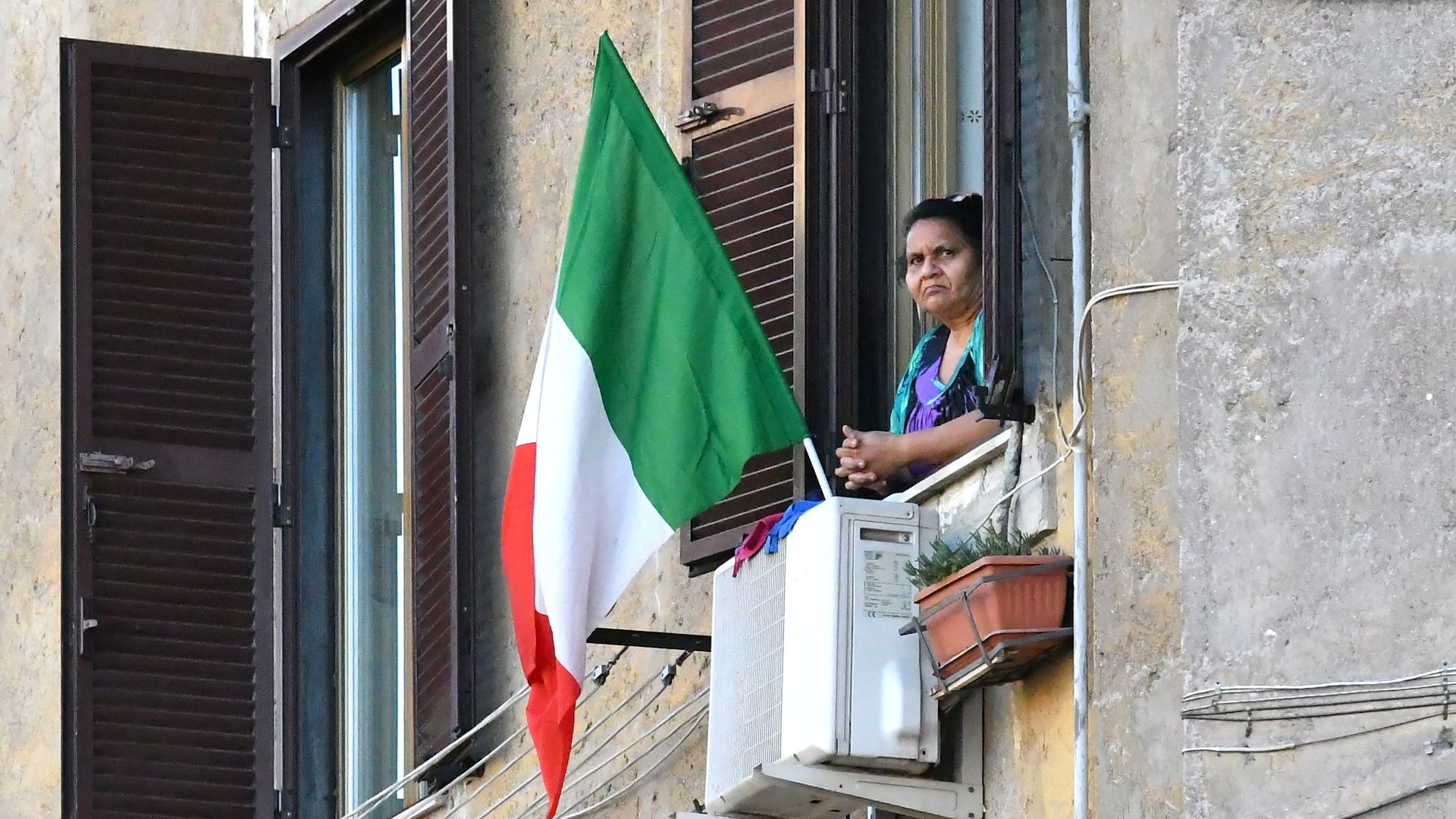 A person looking from their window.