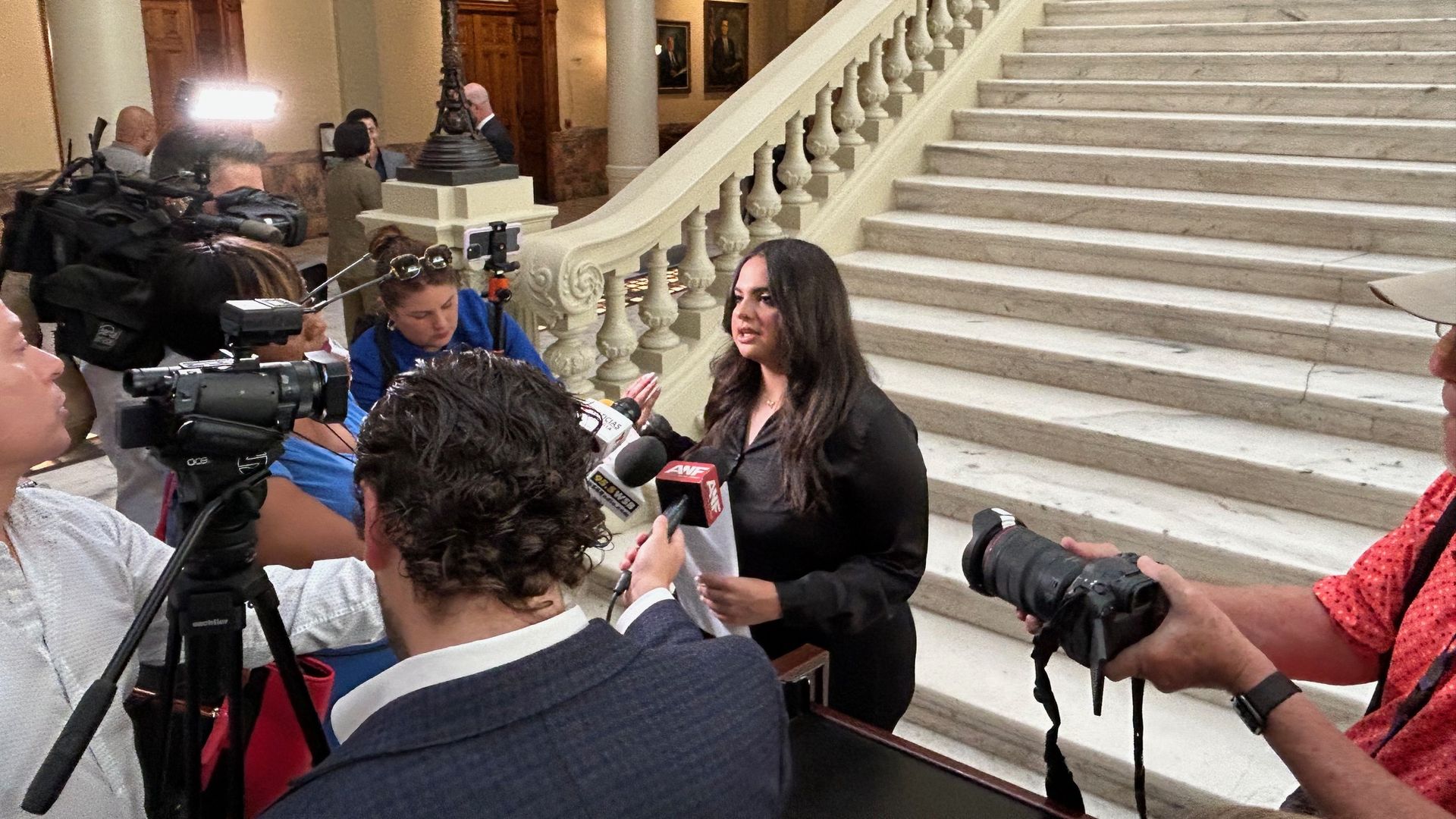 Katherine Guevara, daughter of journalist Mario Guevara, speaks to reporters at the Georgia state capitol following a press conference where she, state lawmakers and advocacy groups called for her father to be released from ICE custody.