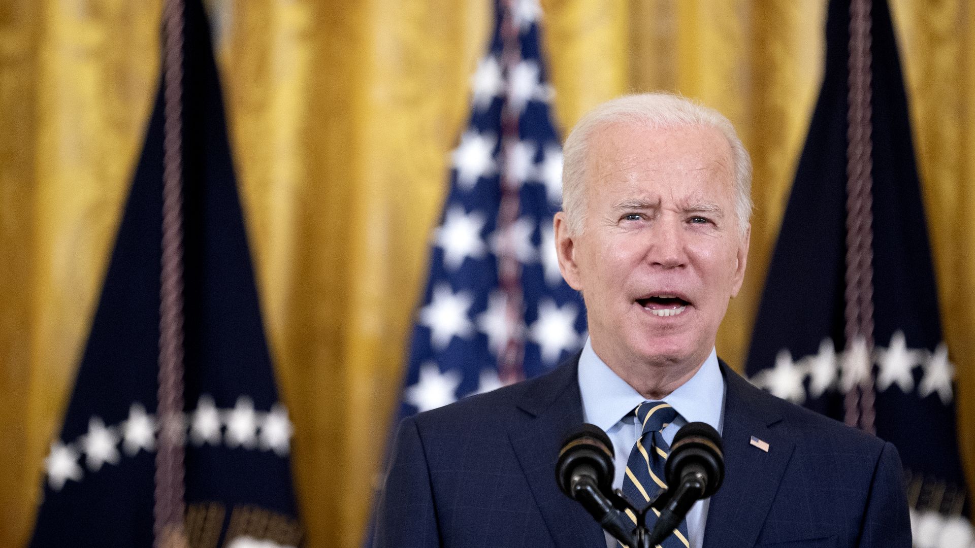 President Biden is seen speaking at the White House.