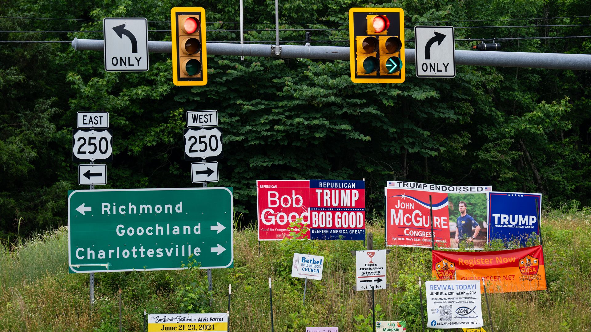 Campaign signs for Rep. Bob Good (R-Va.) and John McGuire near Goochland, Va., on June 14.