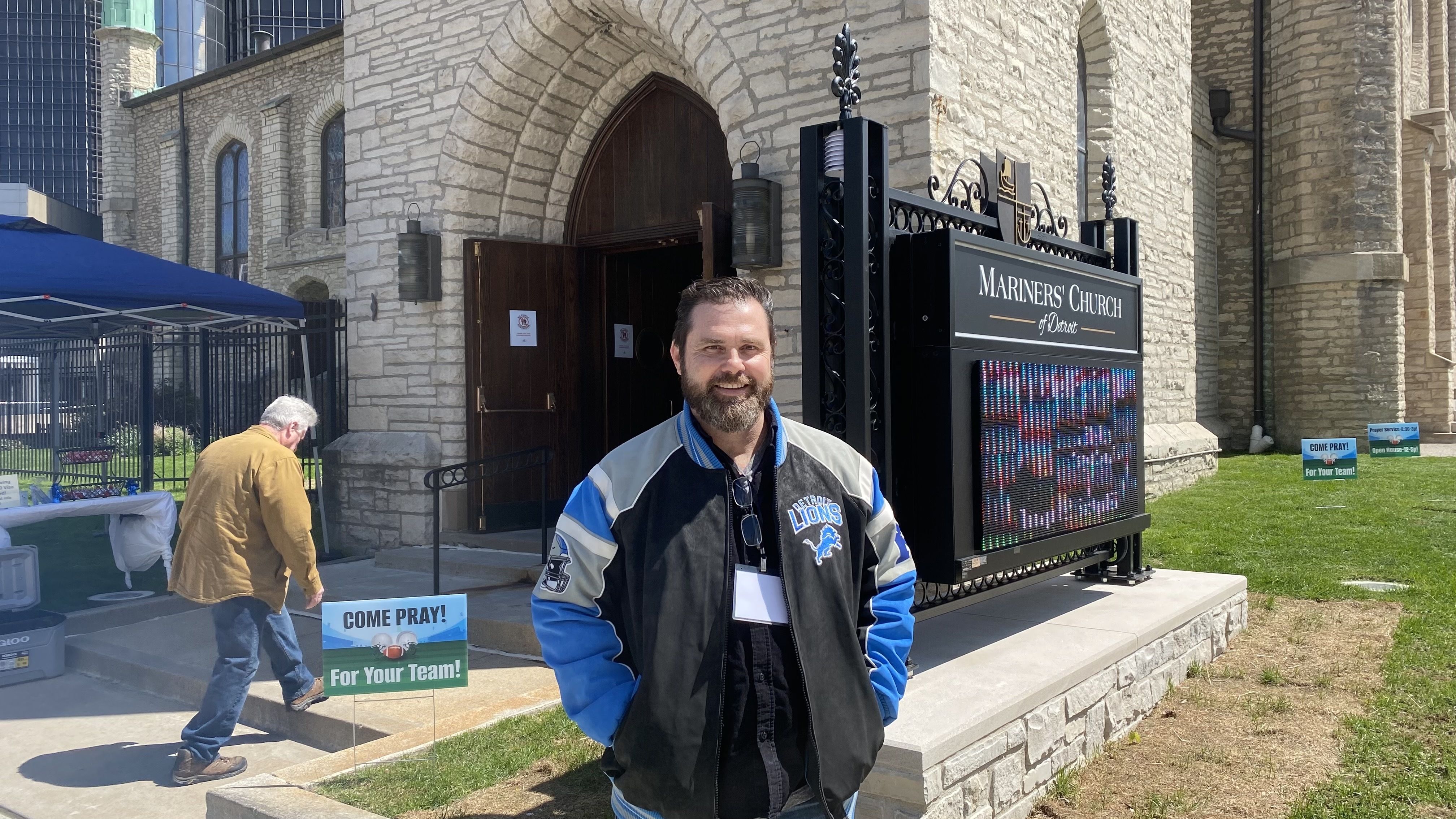 The reverend in front of his church.