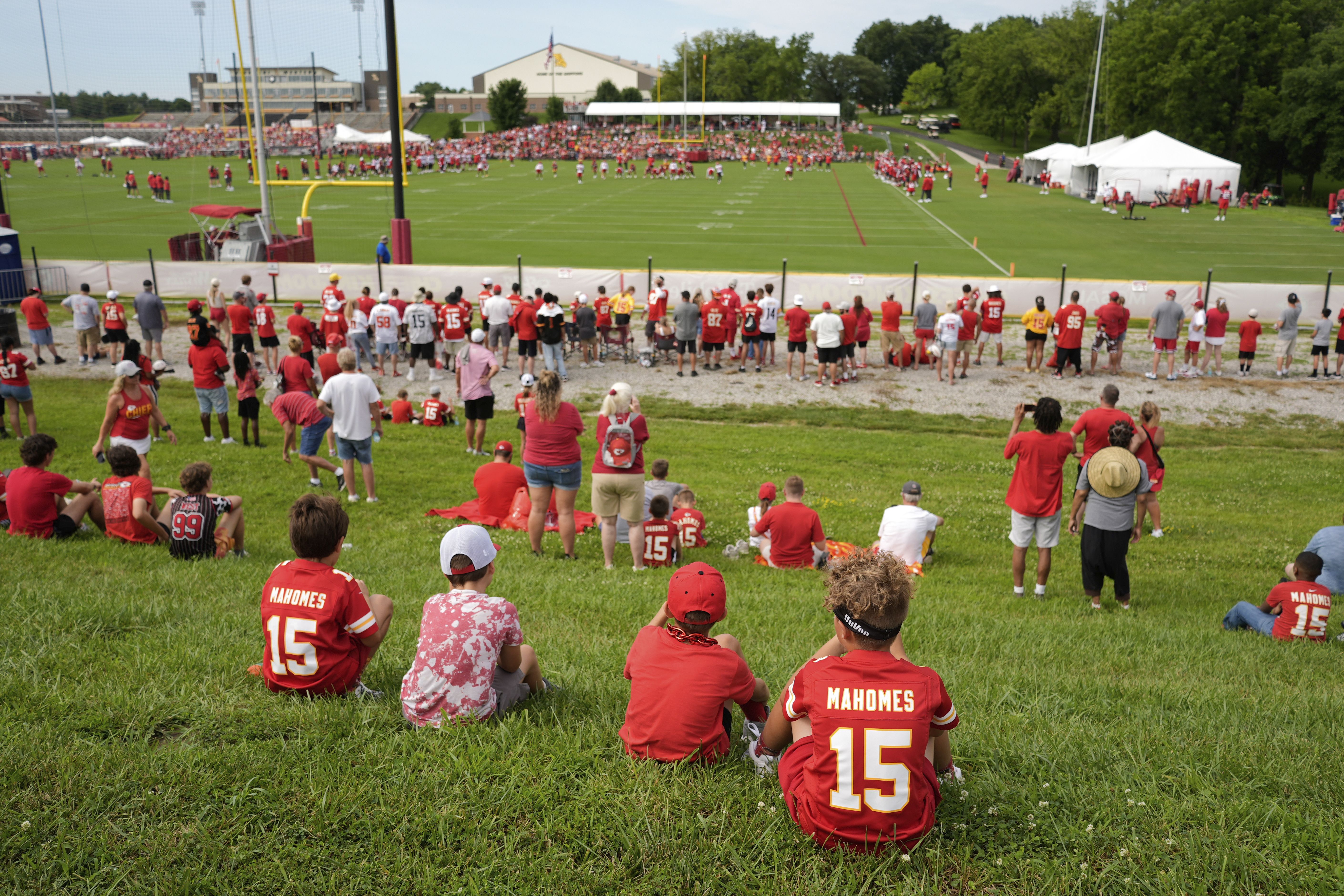 Fans watch the Kansas City Chiefs' first training camp practice yesterday at Missouri Western State University in St. Joseph, Mo. — about an hour north of the team's stadium. 