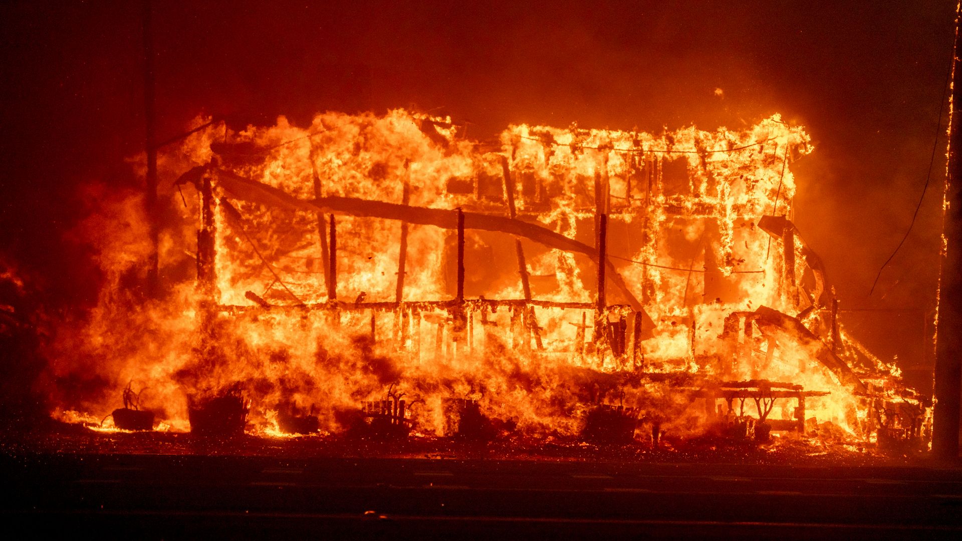 A structure burns during the Palisades Fire in the Pacific Palisades neighborhood of Los Angeles, California, US, on Tuesday, Jan. 7, 2025. Uncontrolled wildfires tore through parts of the Los Angeles region, fanned by extreme winds, forcing thousands of residents to flee and grounding firefighting 