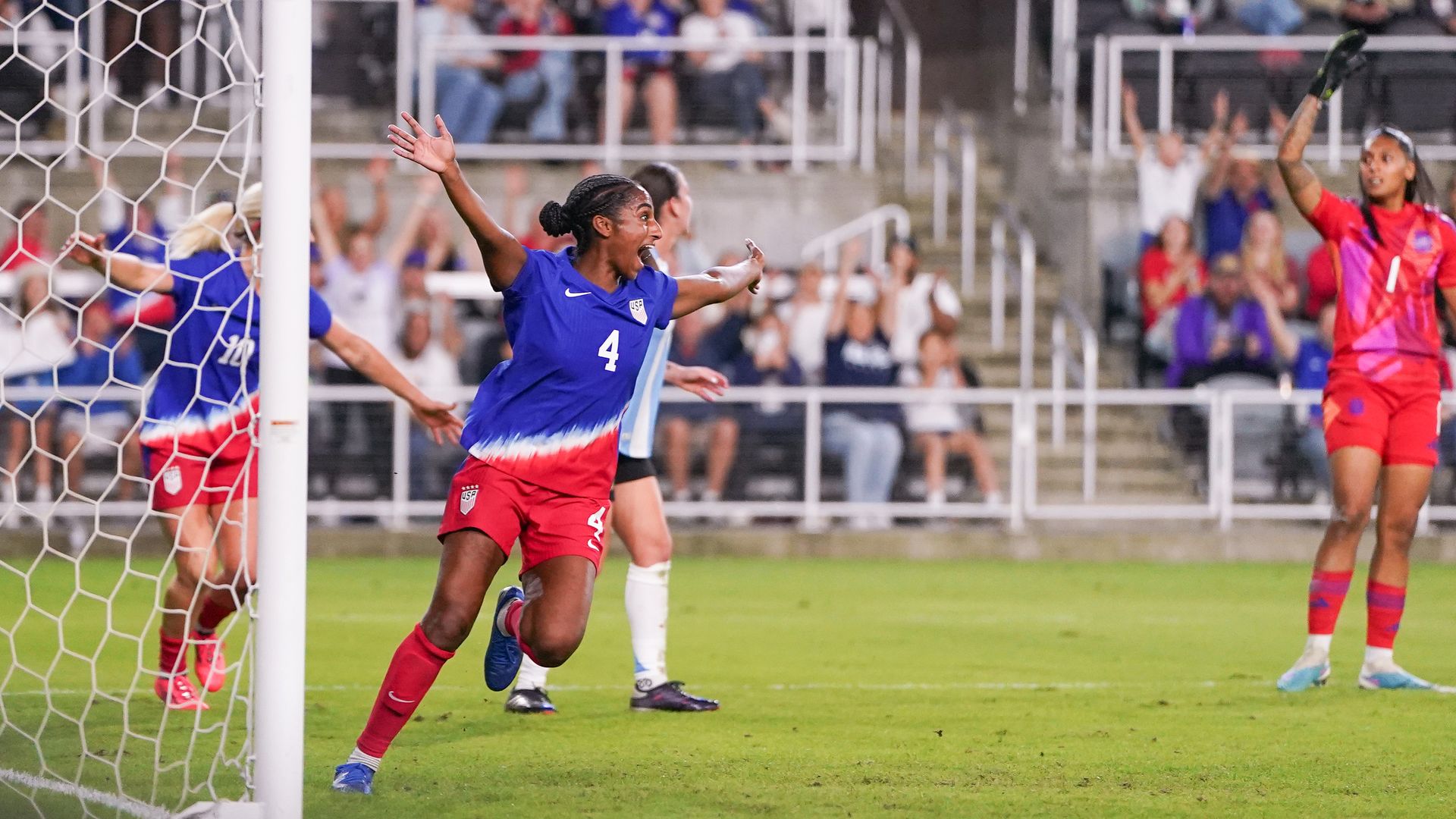 USWNT defender Naomi Girma celebrates on the field after scoring a goal. 