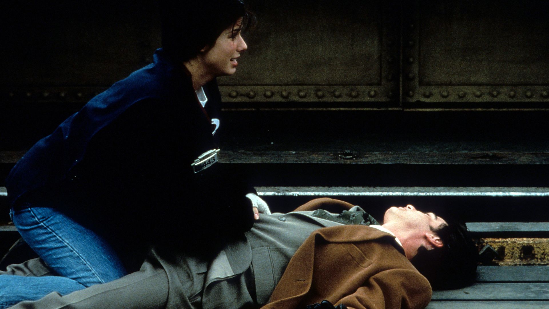 Photo of actors on railroad tracks trying to get off them