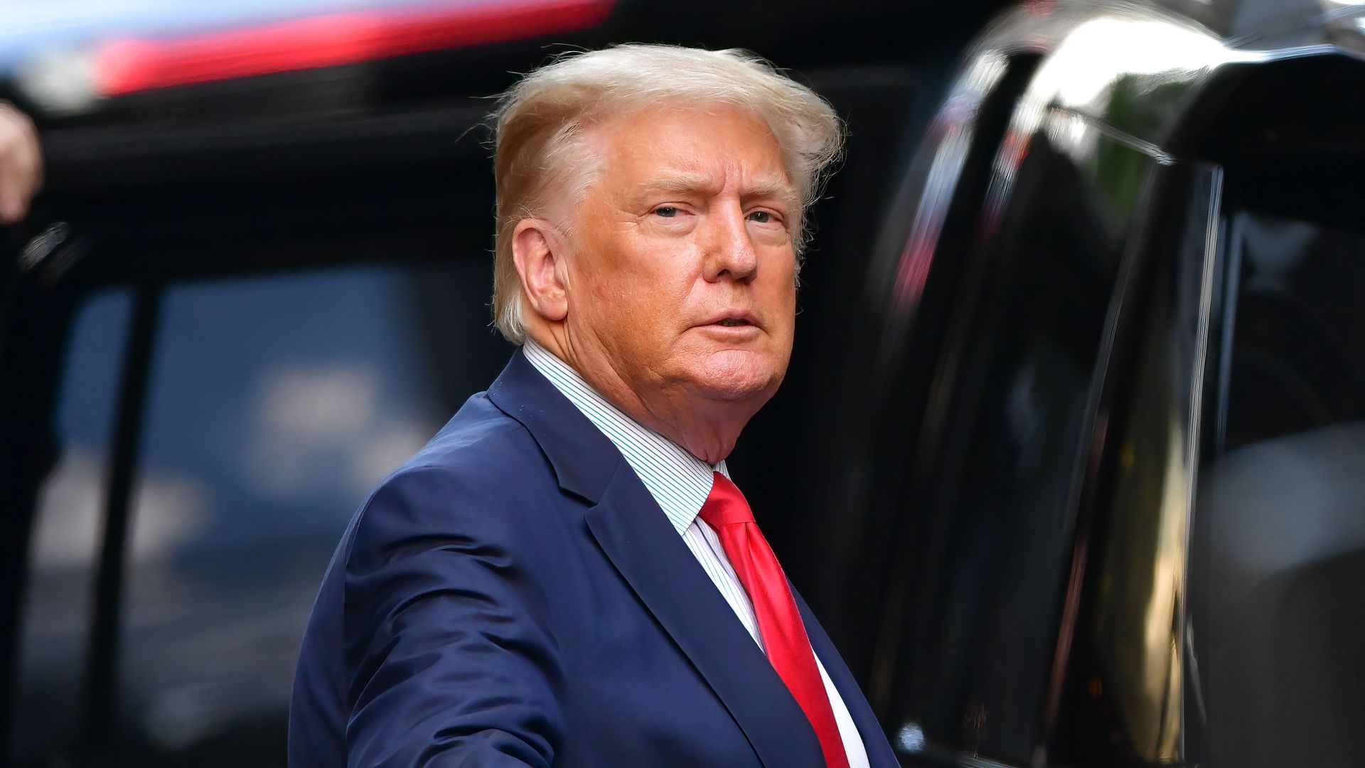 Photo of Donald Trump as he's about to get in a vehicle