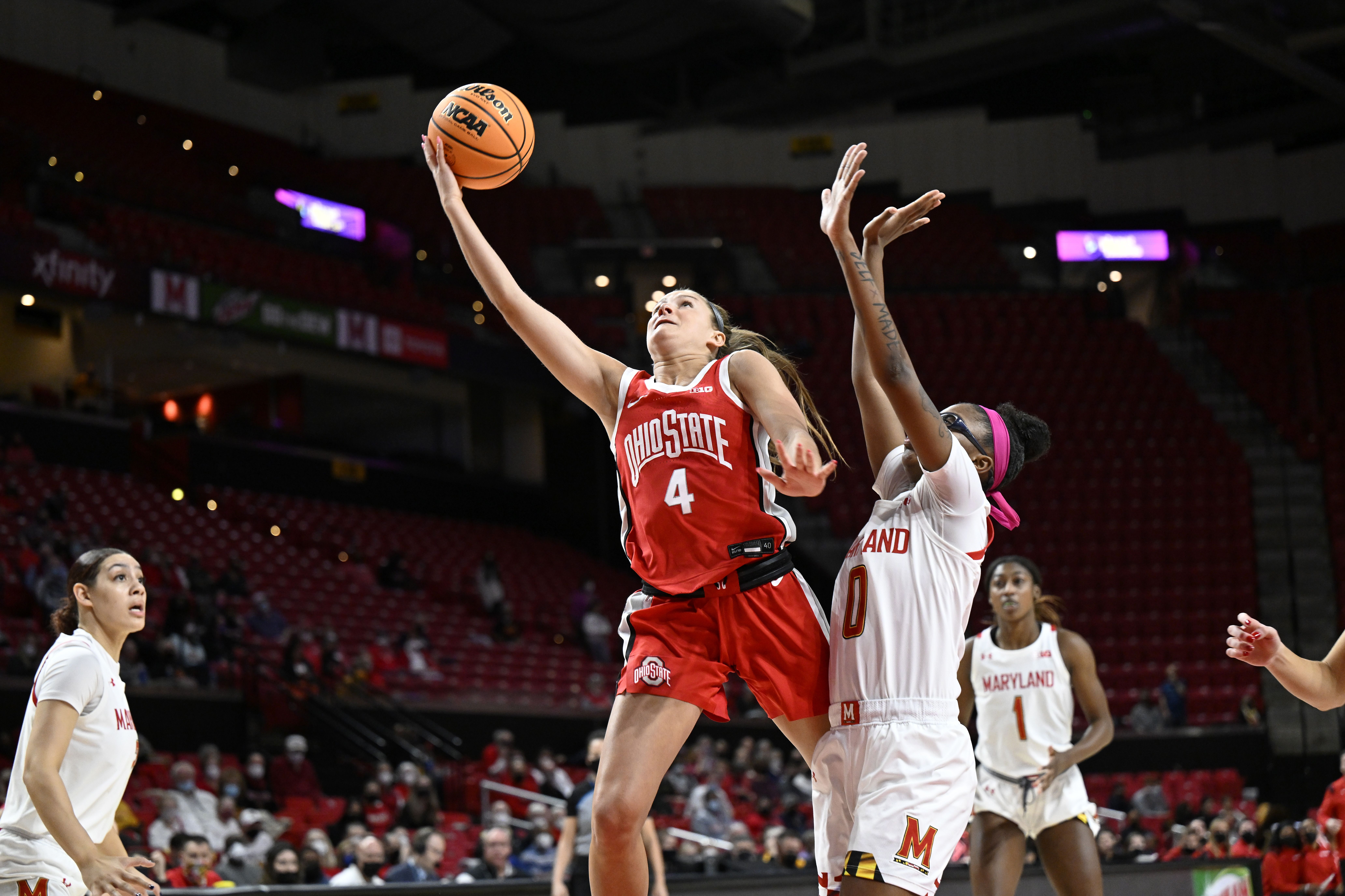 Ohio State player Jacy Sheldon rises for a lay-up against a Maryland defender.