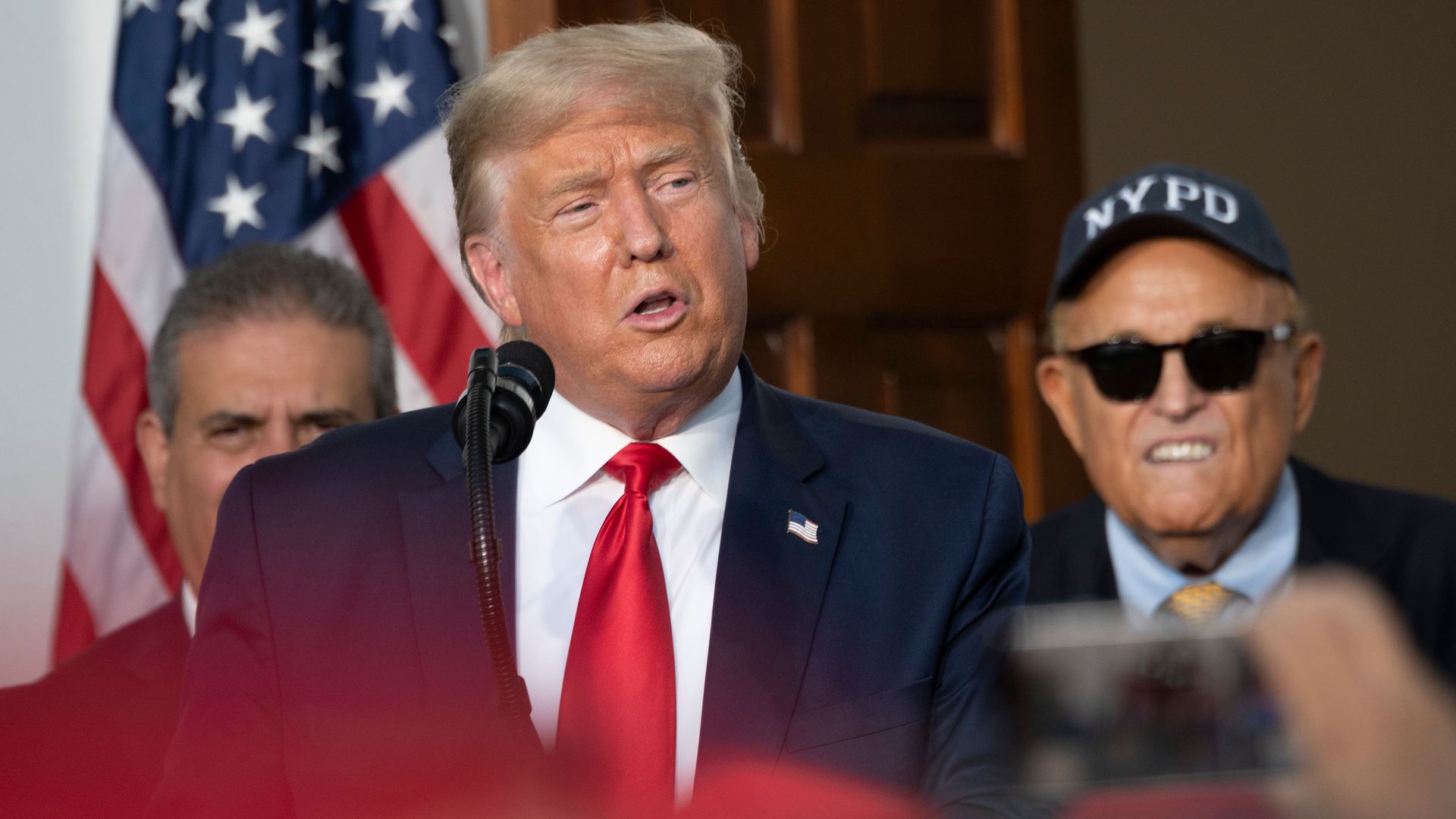 Lawyer Rudy Giuliani listens as President Donald Trump delivers remarks to the City of New York Police Benevolent Association in Bedminster, NJ, on August 14, 2020.