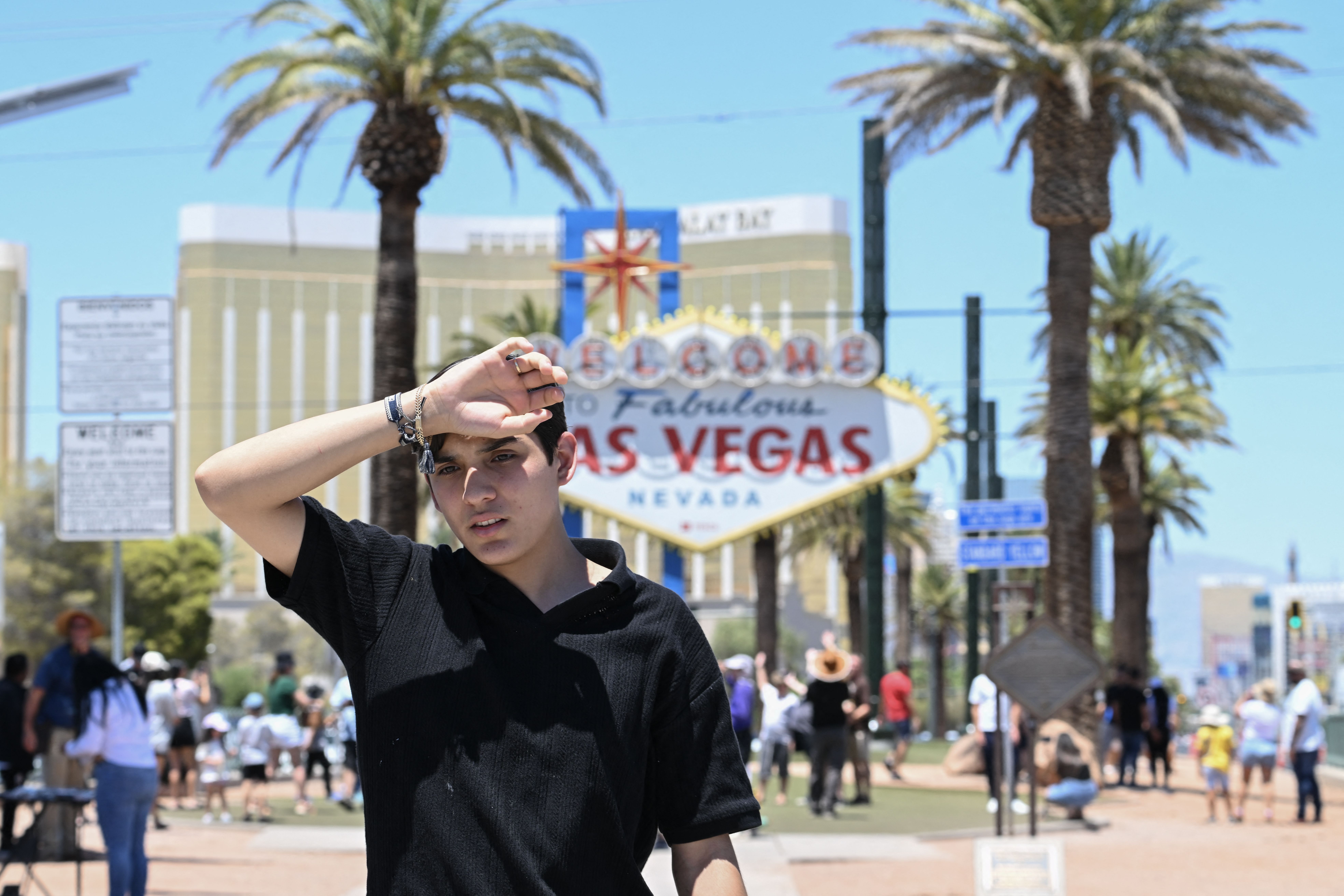 A man walks near the Las Vegas strip during a heatwave in Las Vegas, Nevada on July 7, 2024. According to the US National Weather Service, high temperatures in Las Vegas on Sunday could reach up to 117 degrees Farenheit 