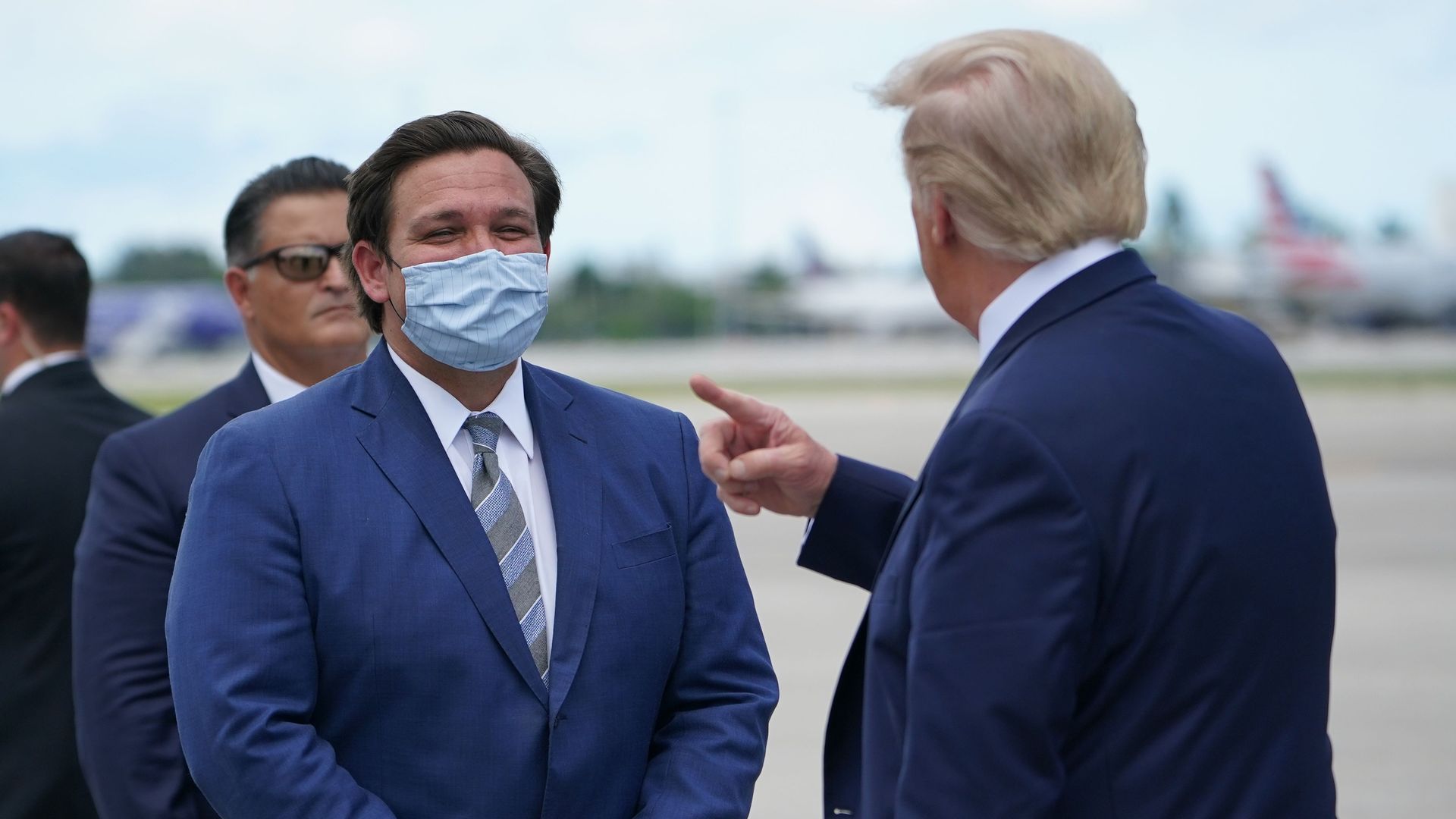 President Donald Trump speaks with Governor of Florida Ron DeSantis