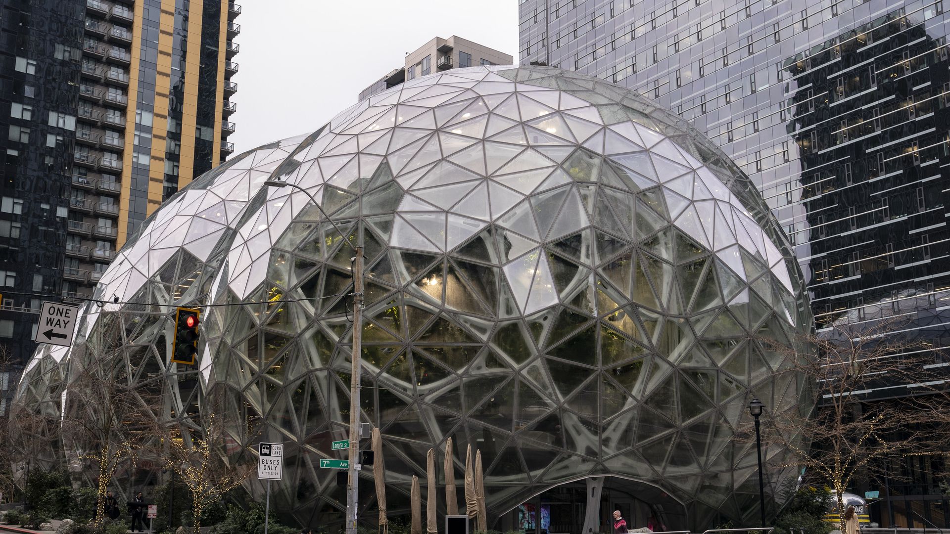Large metallic spheres in the middle of a public plaza.