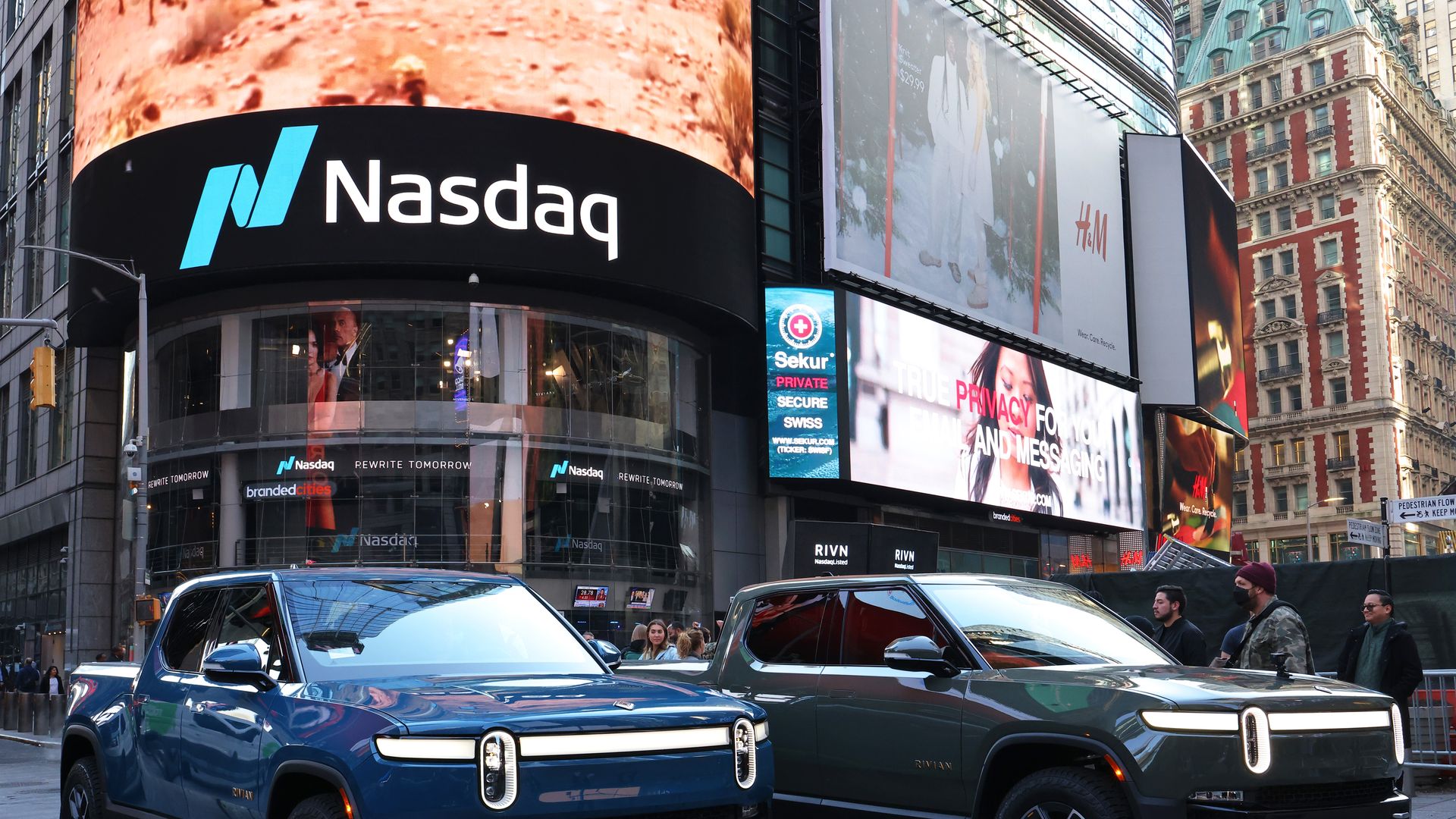 Photo of Rivian trucks in front of the Nasdaq building