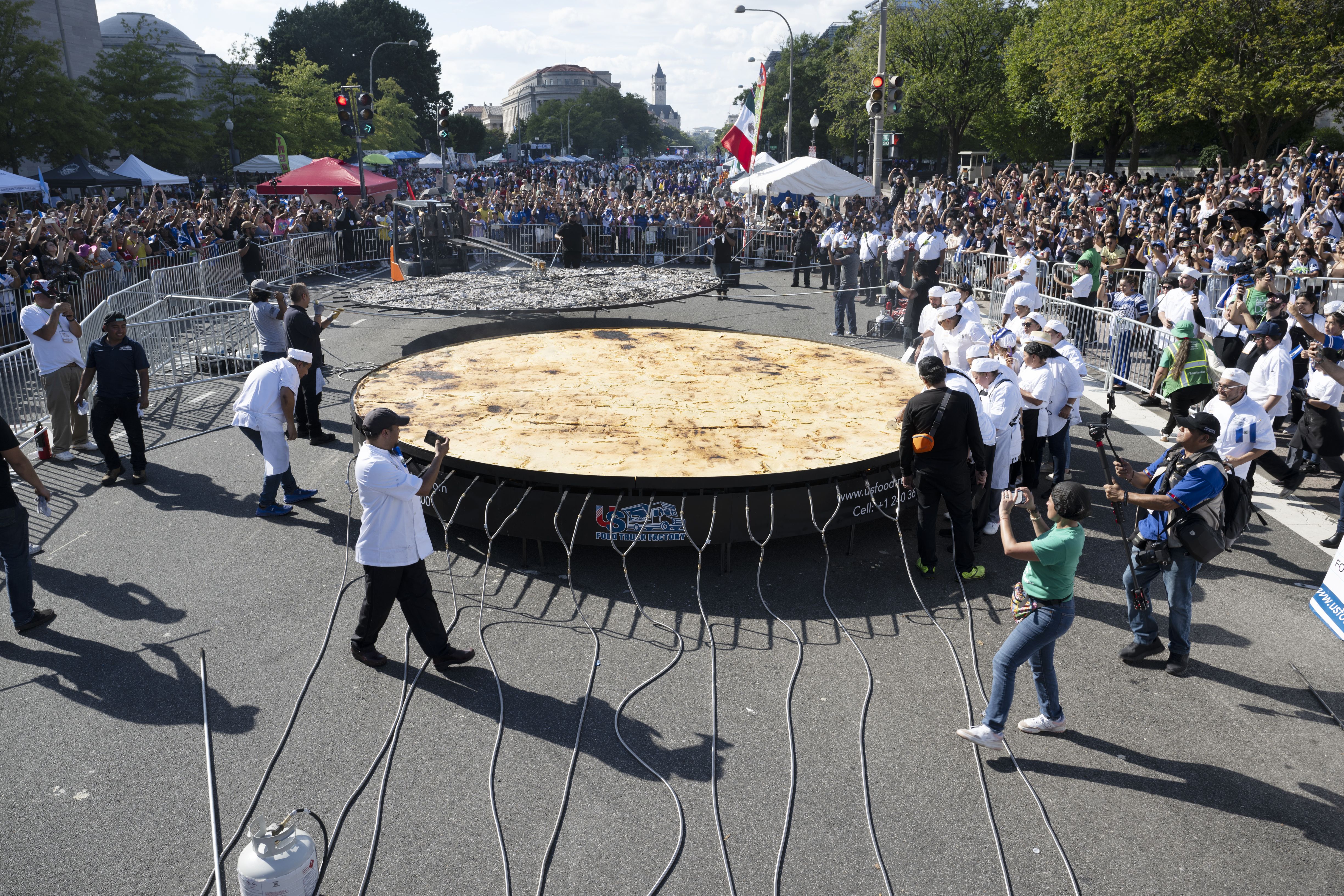 A giant pupusa being made on Pennsylvania Avenue at Fiesta DC 2024