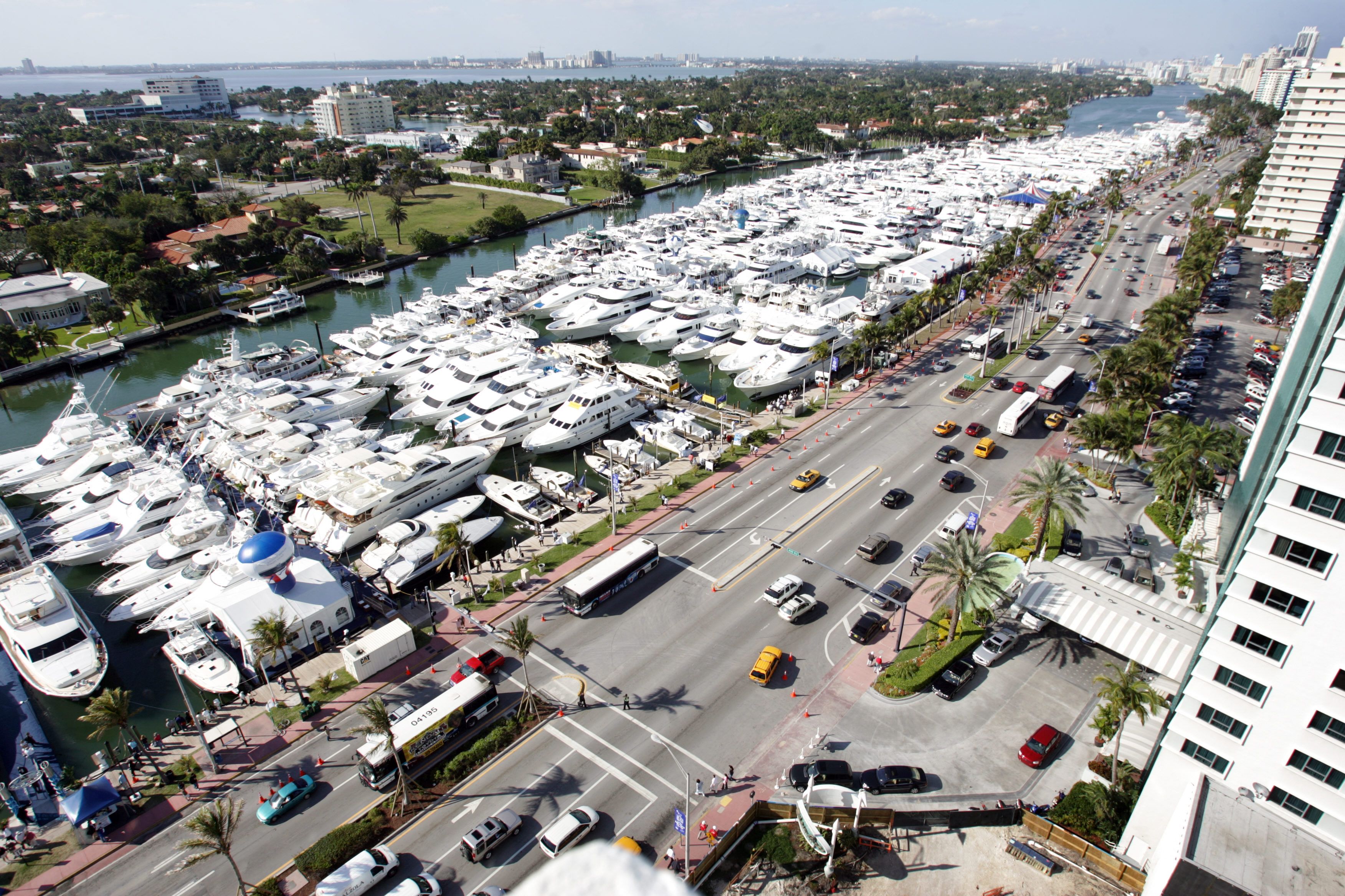 TOPSHOT - Yatchs on display at the Miami Yacht and Brokerage Show are moored on an intercoastal canal in Miami Beach, Florida 19 February 2007. The Miami Yacht and Brokerage Show and the Miami International Boat Show are two of the world's largest displays of boats for sale. (Photo by ROBERTO SCHMID