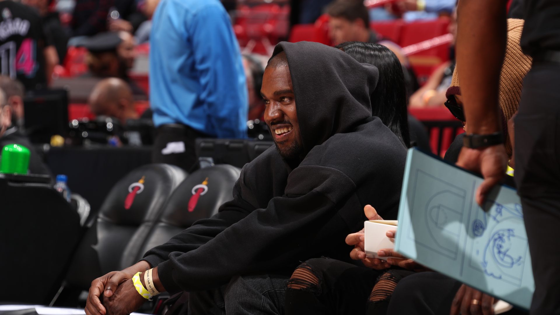 Kanye West attends a basketball game