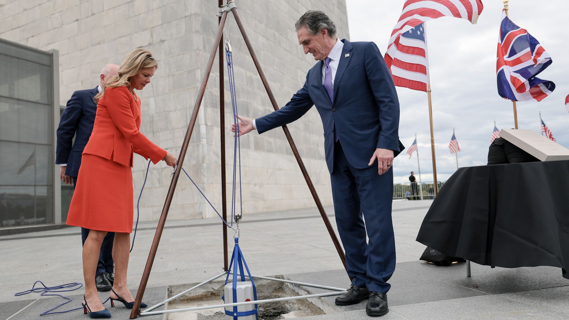 A time capsule is lowered into the ground on the Washington Monument grounds