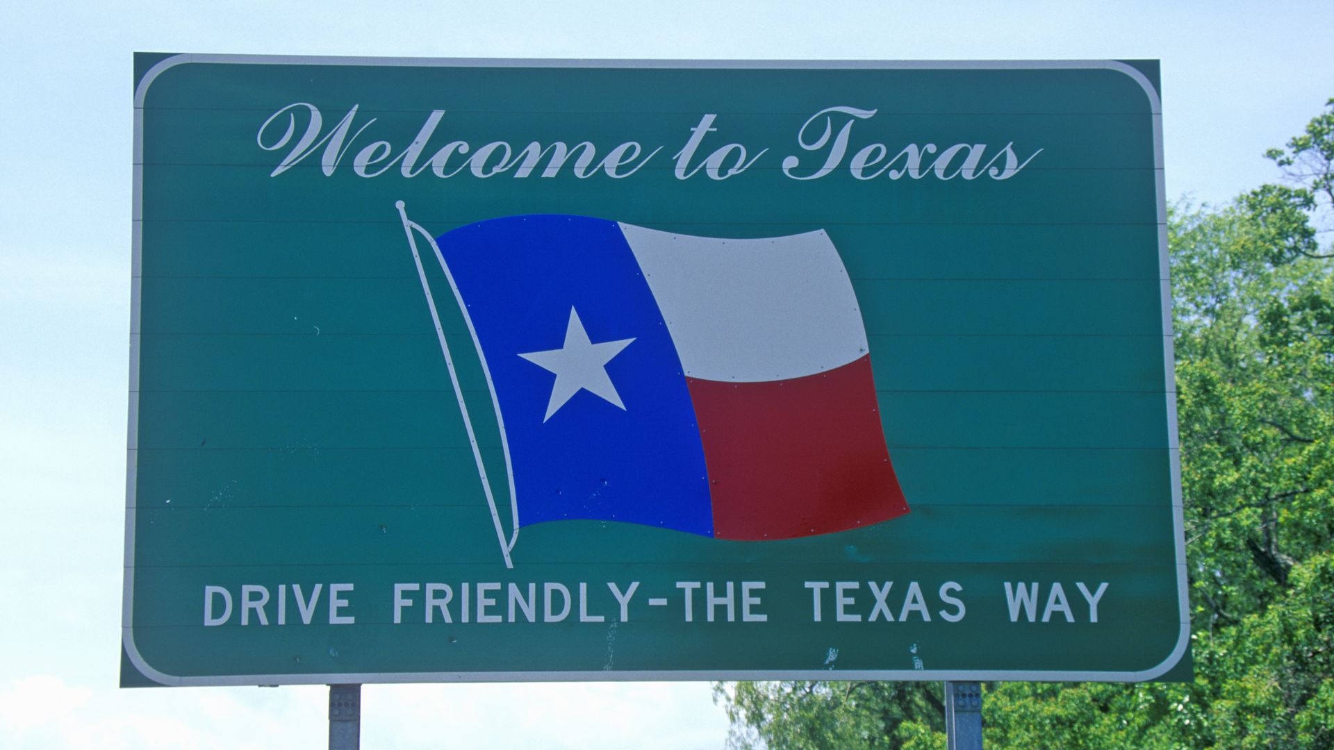 A Welcome to Texas sign.