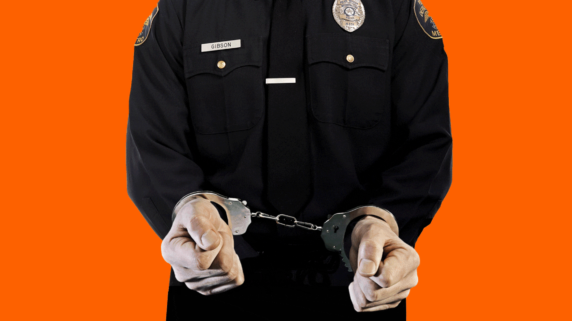 police officer in disappearing handcuffs