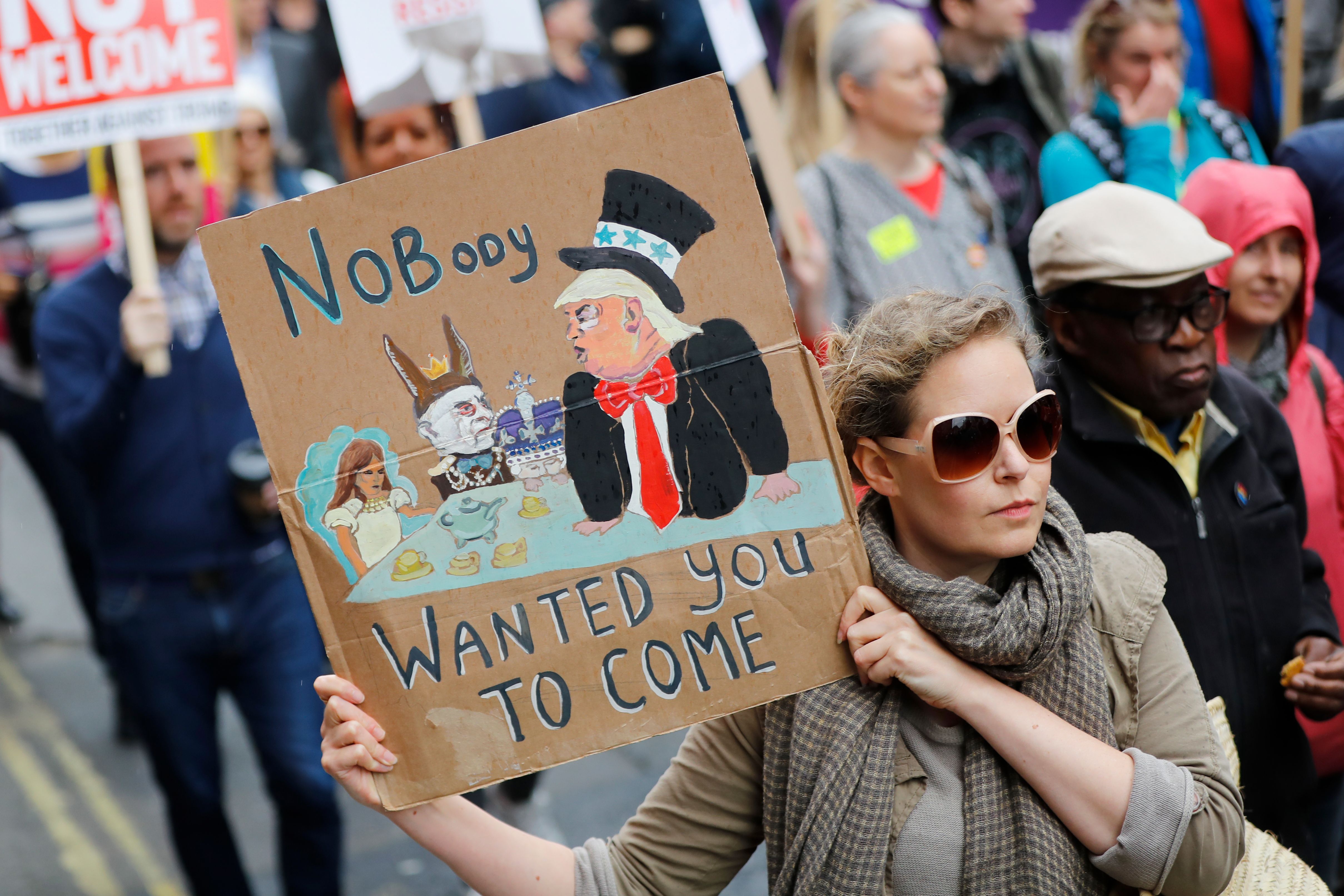Demonstrators protest against the visit of US President Donald Trump along Whitehall in London.