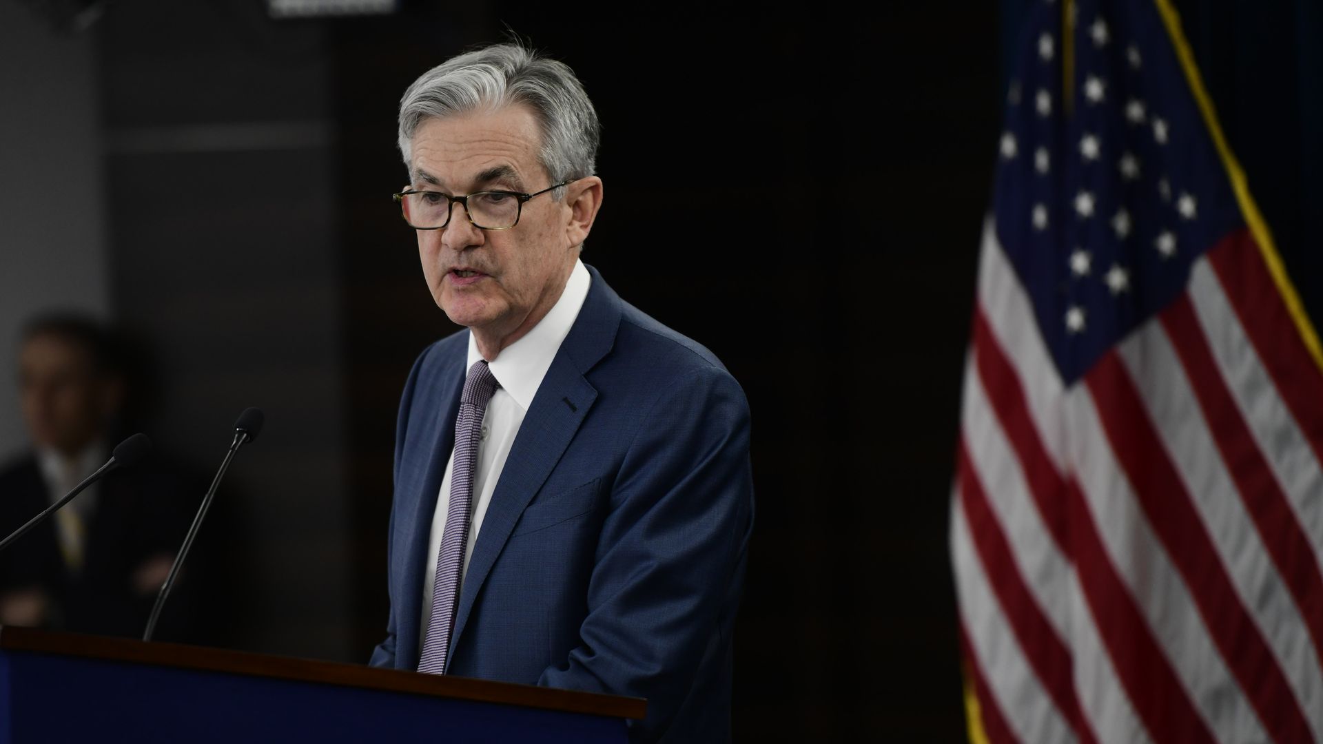 Federal Reserve Chair Jerome H. Powell speaking at a podium
