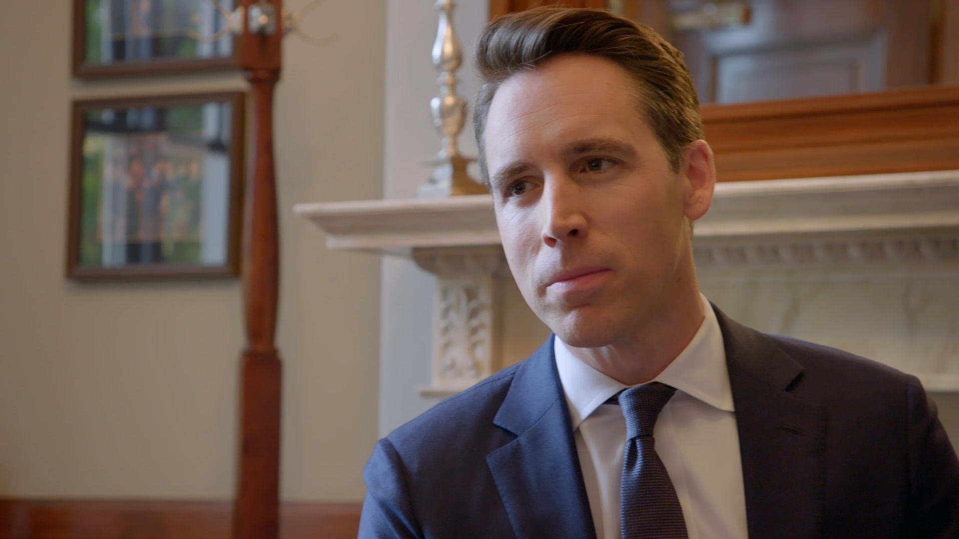 Photo of Sen. Josh Hawley in a blue blazer and tie