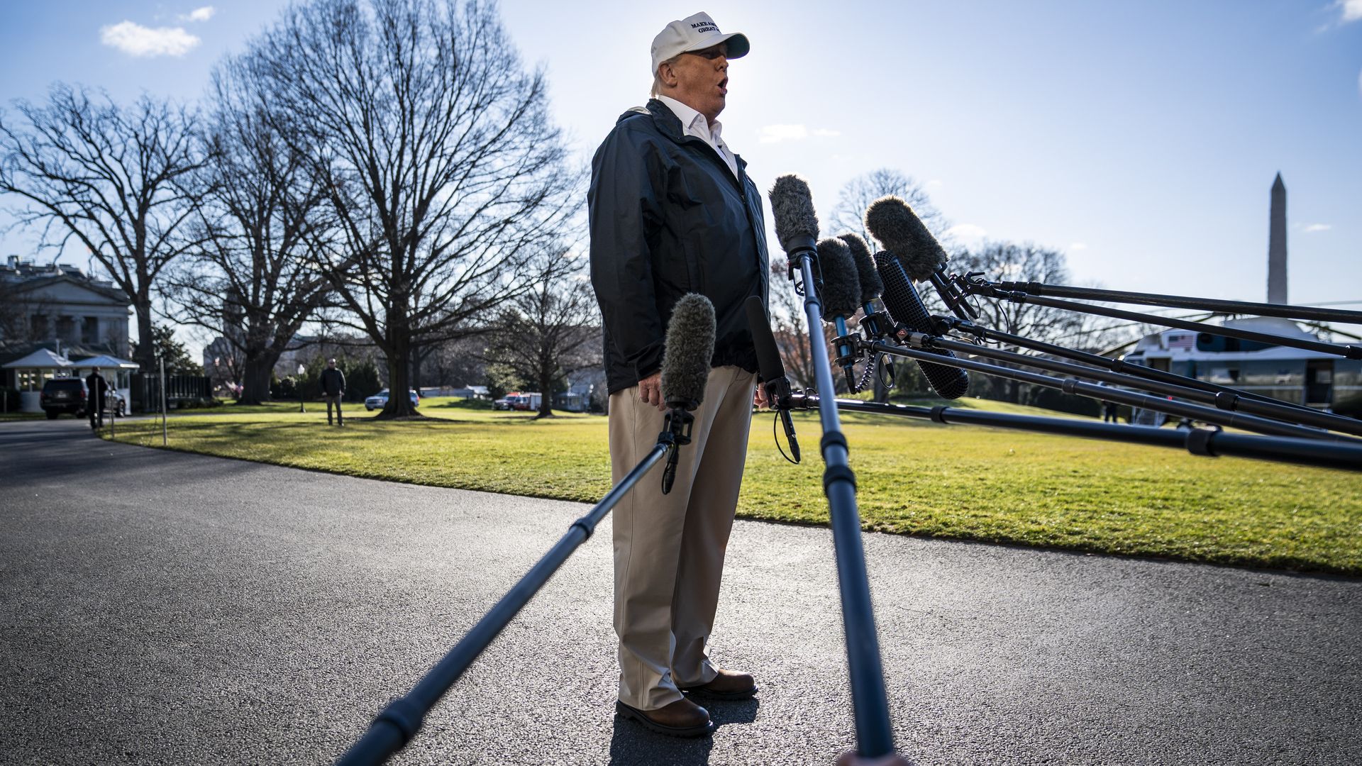 President Donald J. Trump stops to talk to reporters as he walks to board Marine One on the 20th day of the partial government shutdown as he departs from the South Lawn at the White House 
